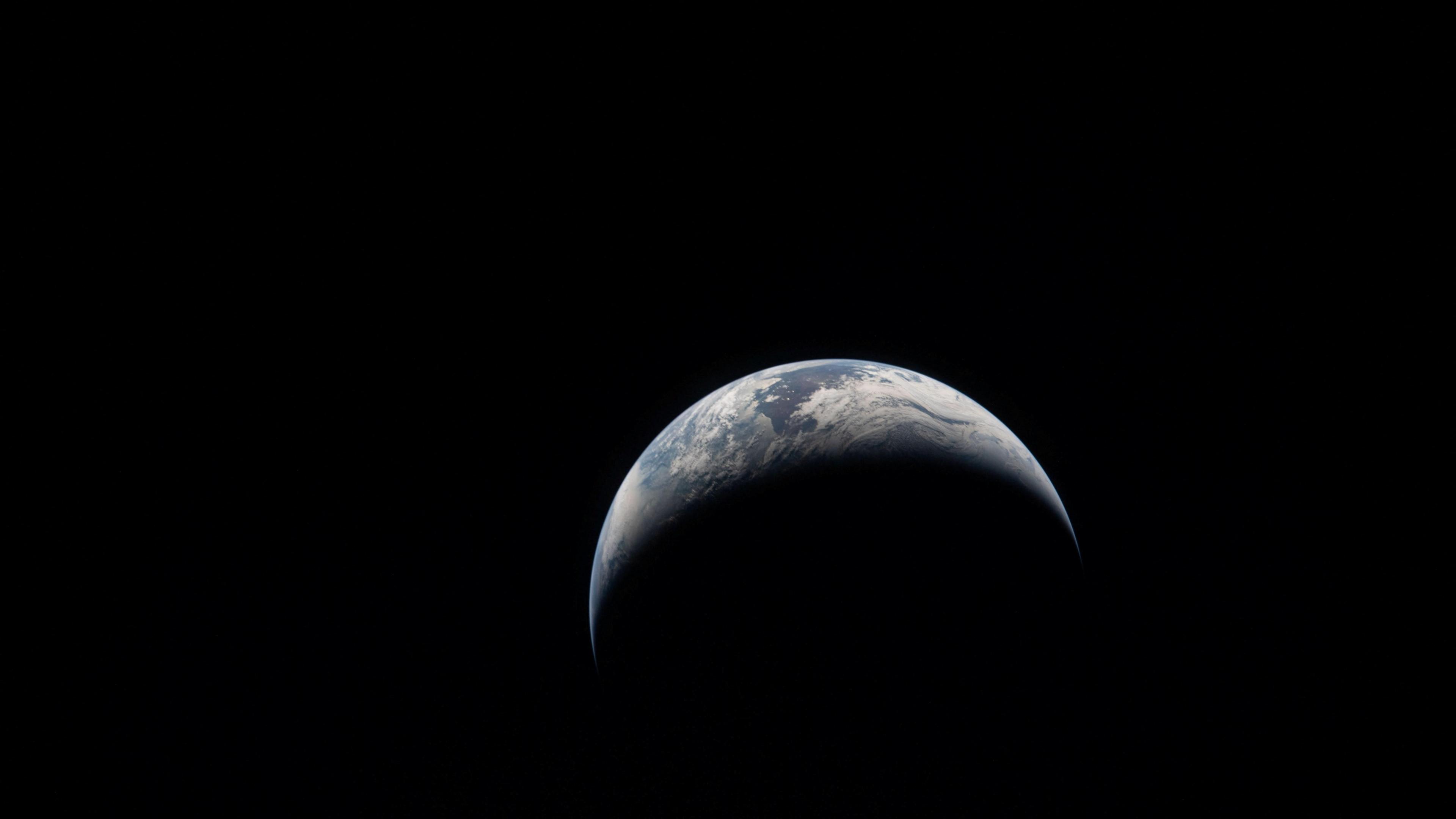 The earth in partial shade as seen from space. 