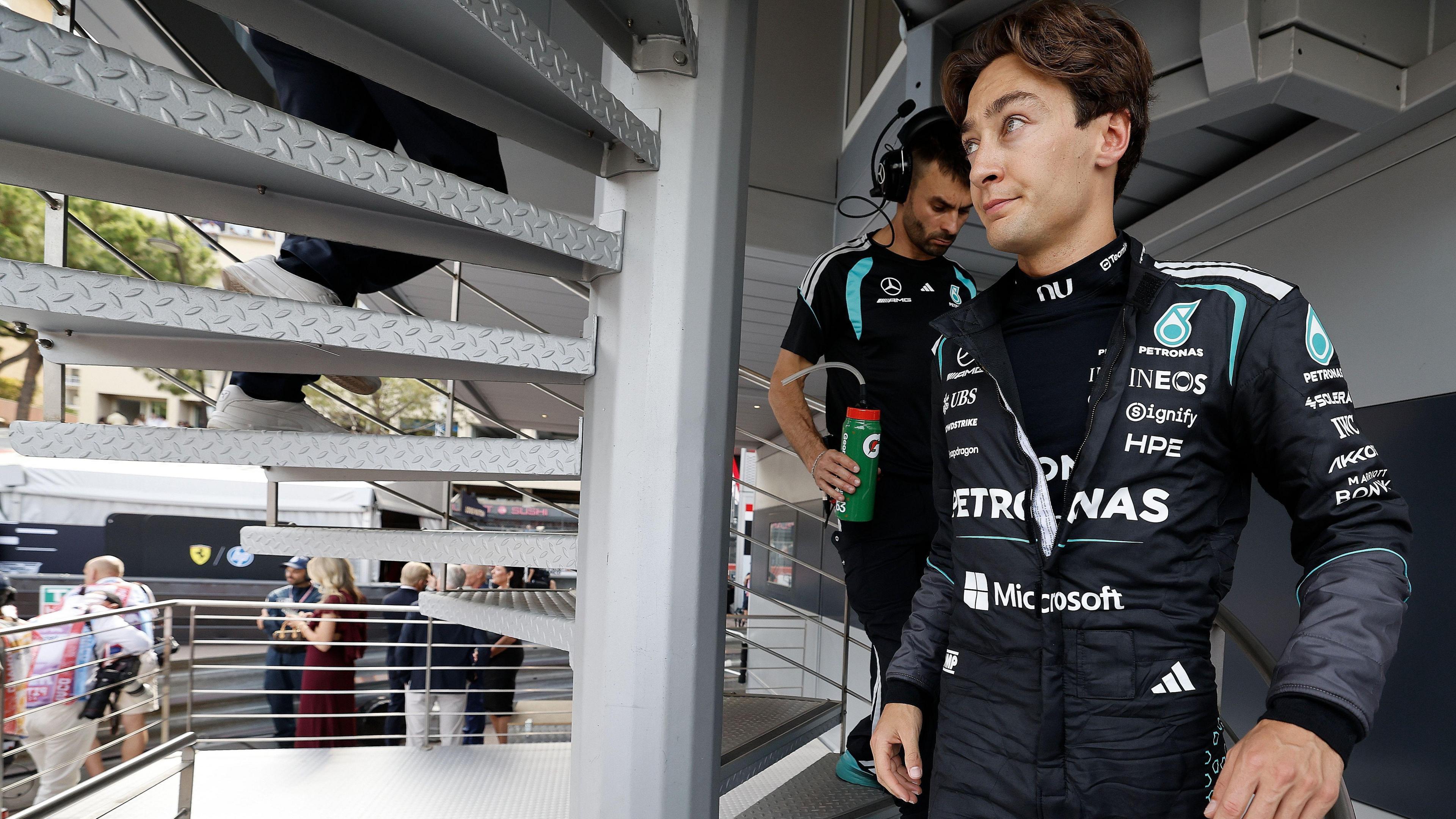 Mercedes driver George Russell coming down a staircase at the Monaco Grand Prix