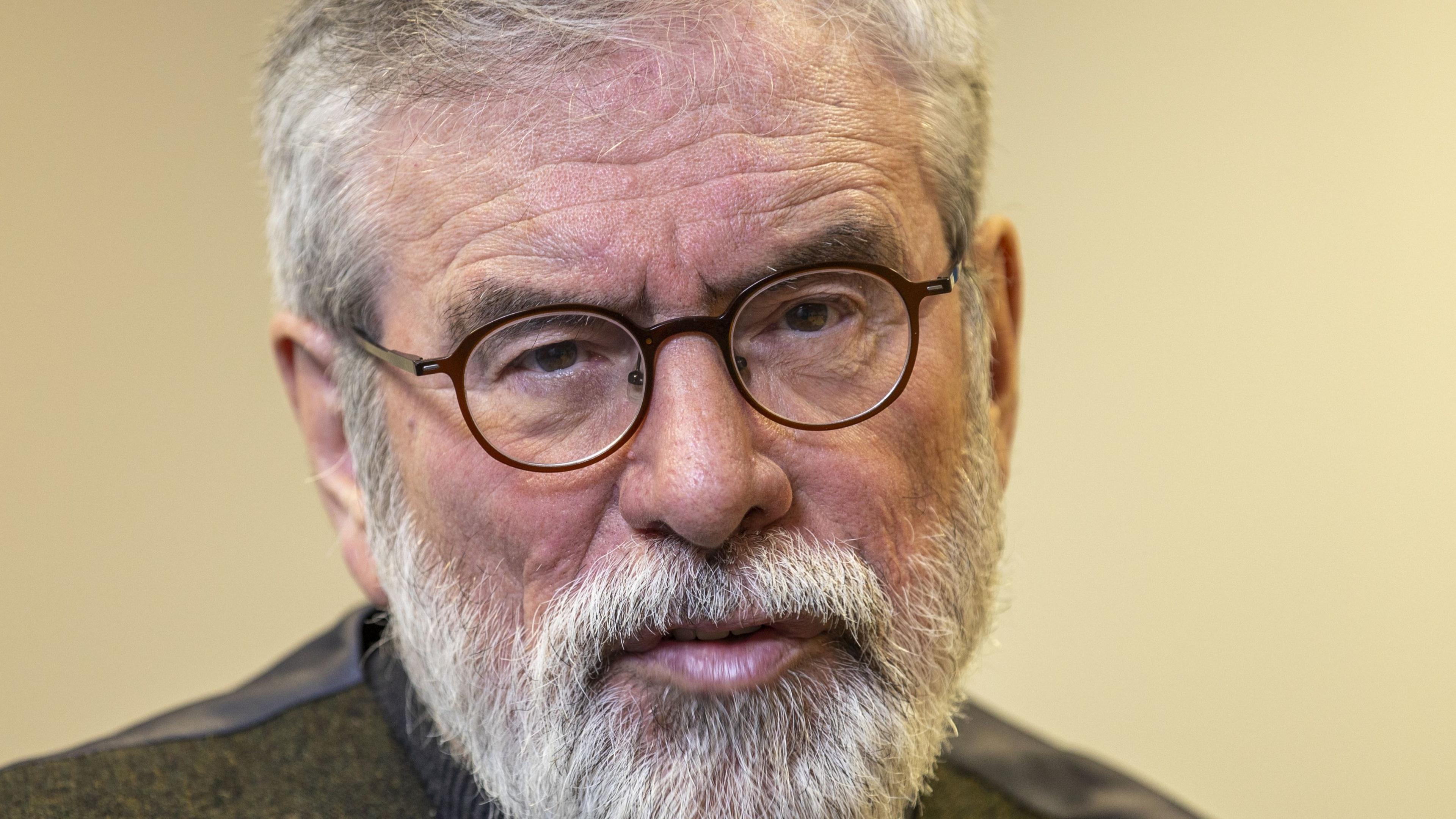 Gerry Adams - he has round-rimmed glasses, grey hair and a short grey beard