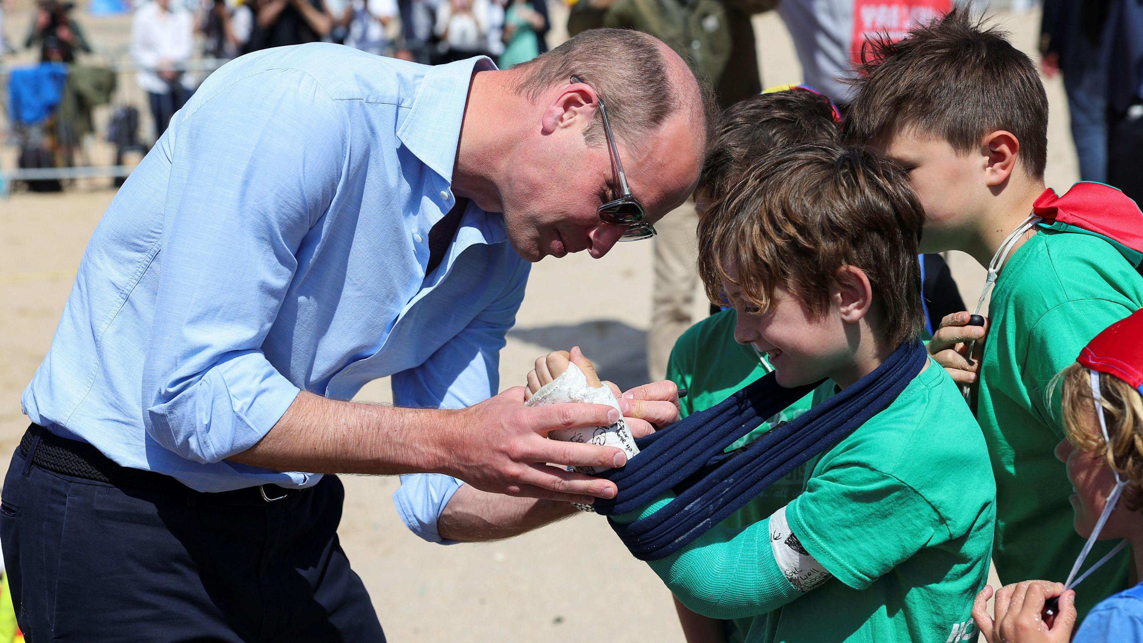 Prince William signing plaster cast