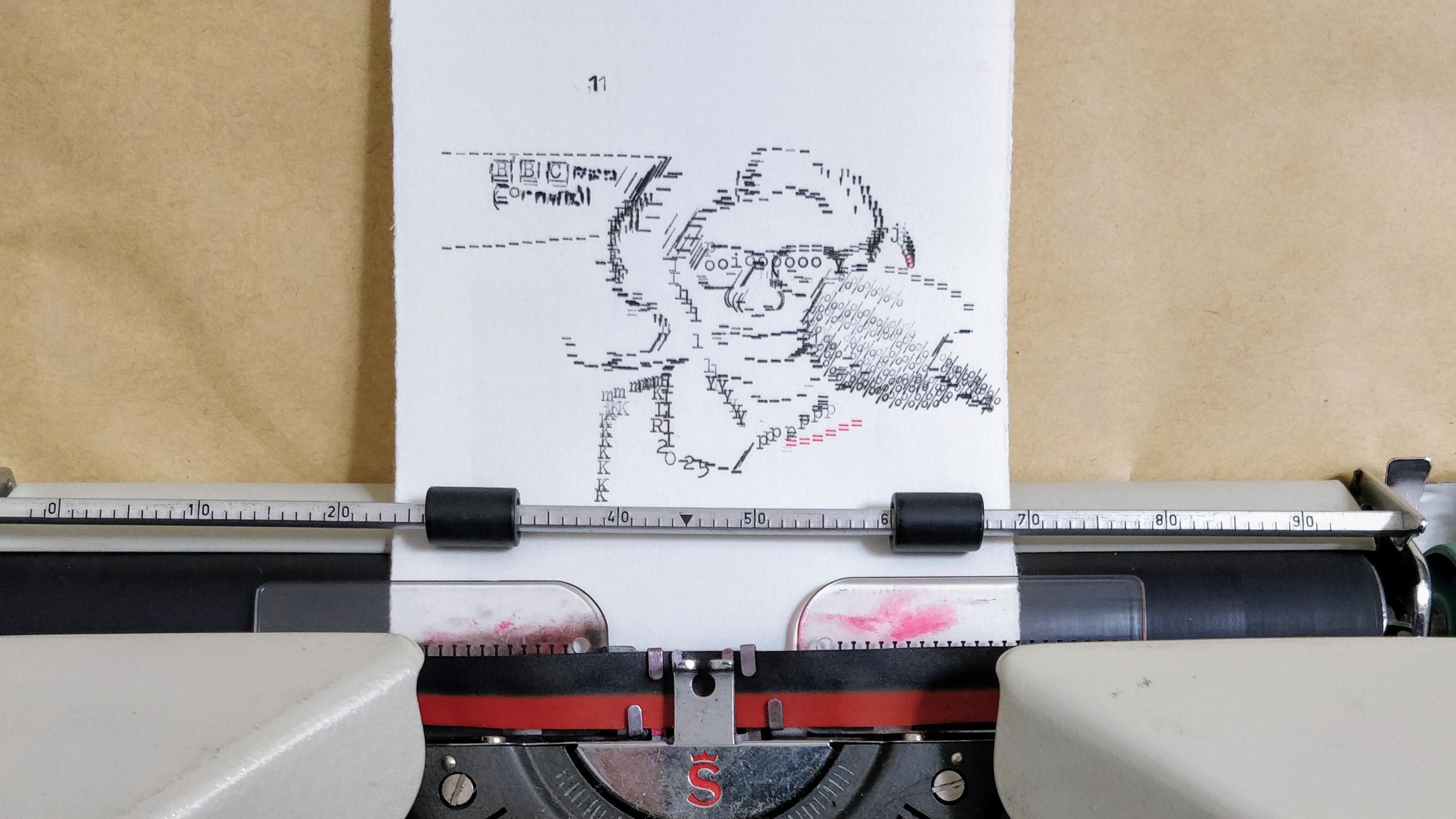 A close-up of a typewriter with a piece of paper in it featuring a portrait of a woman, created using the keys. There is brown paper behind it.