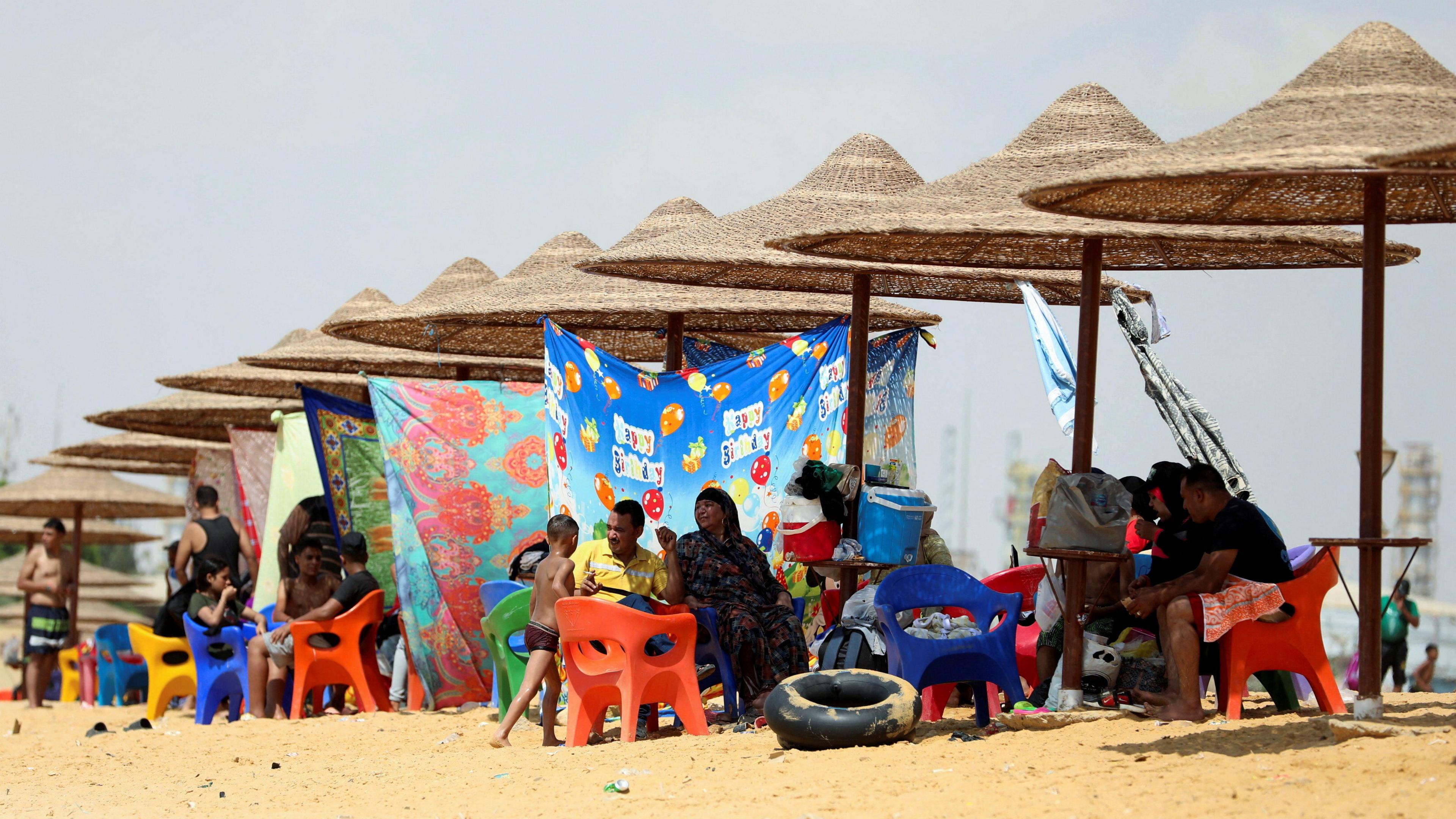 People relax at a private beach at the entrance of the Suez Canal, Egypt - Friday 13 September 2024.