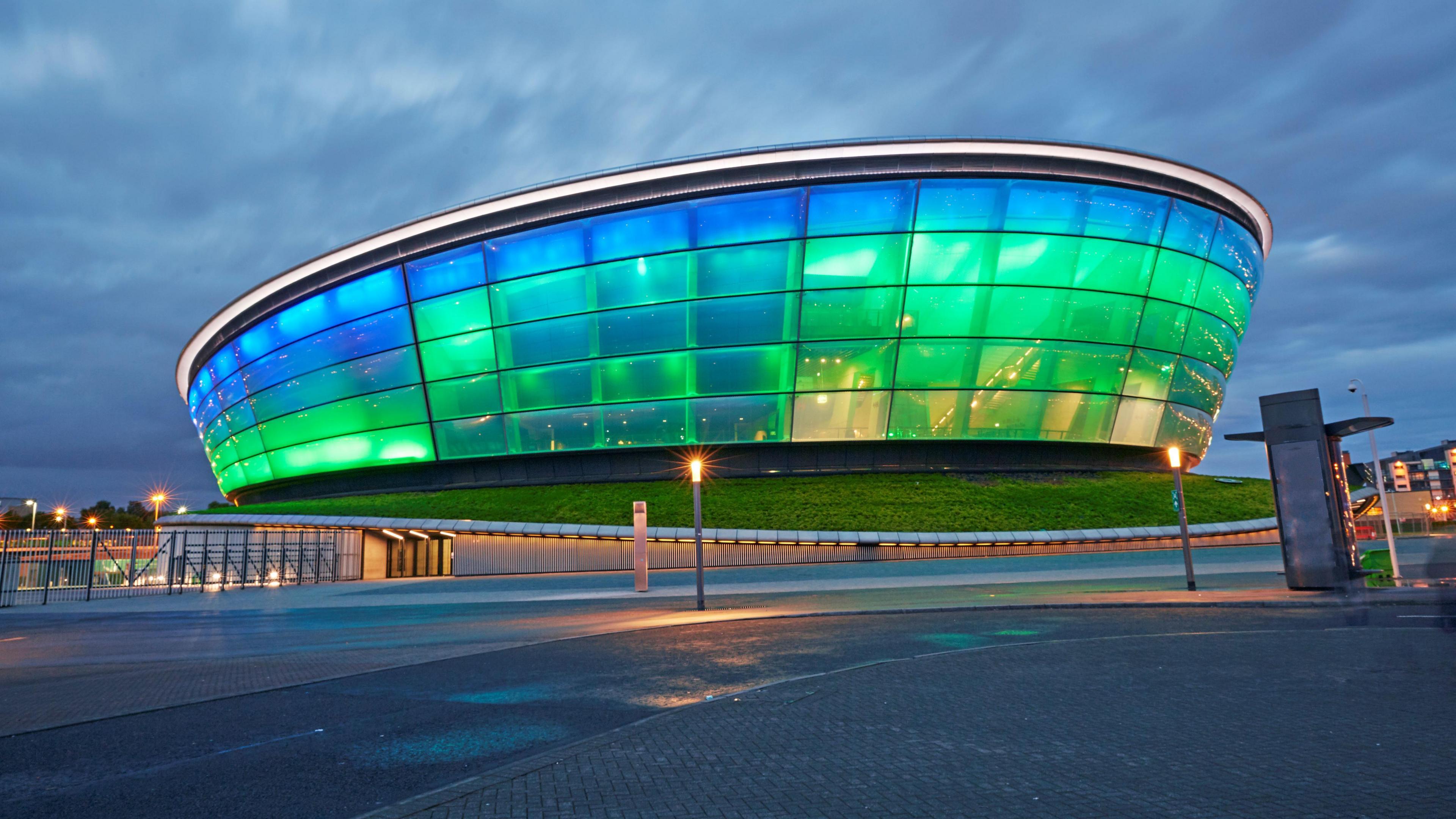 The OVO Hydro in Glasgow - it is lit up in green and blue