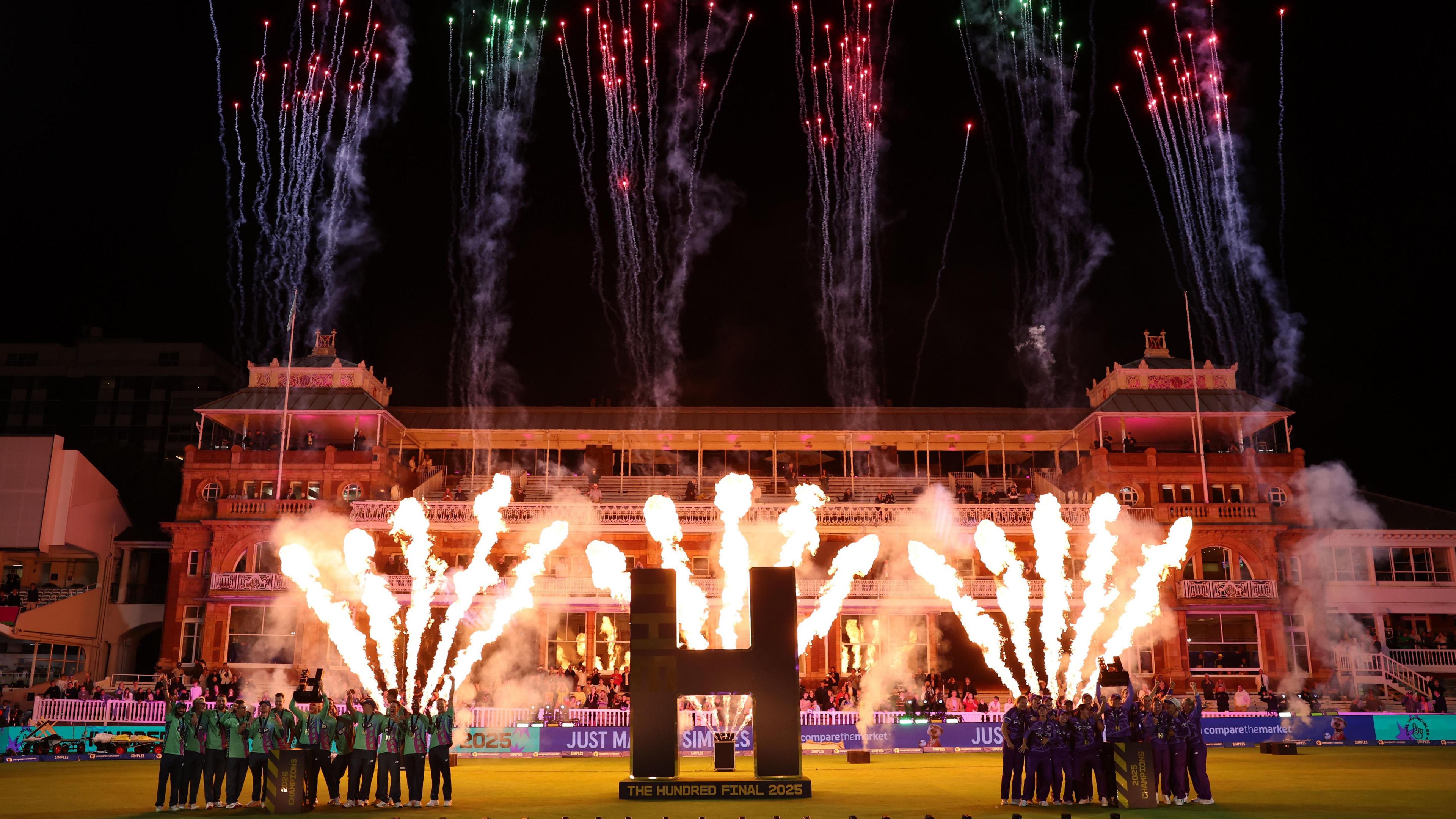 Celebrations for the two victorious Hundred teams at Lords for the 2025 finals of the Hundred. Oval Invincibles men stand on the left and Northern Superchargers women stand on the right. There is a big gold 'H' between then, and the backdrop is Lords pavilion at night, with fire and fireworks behind them in the sky. 