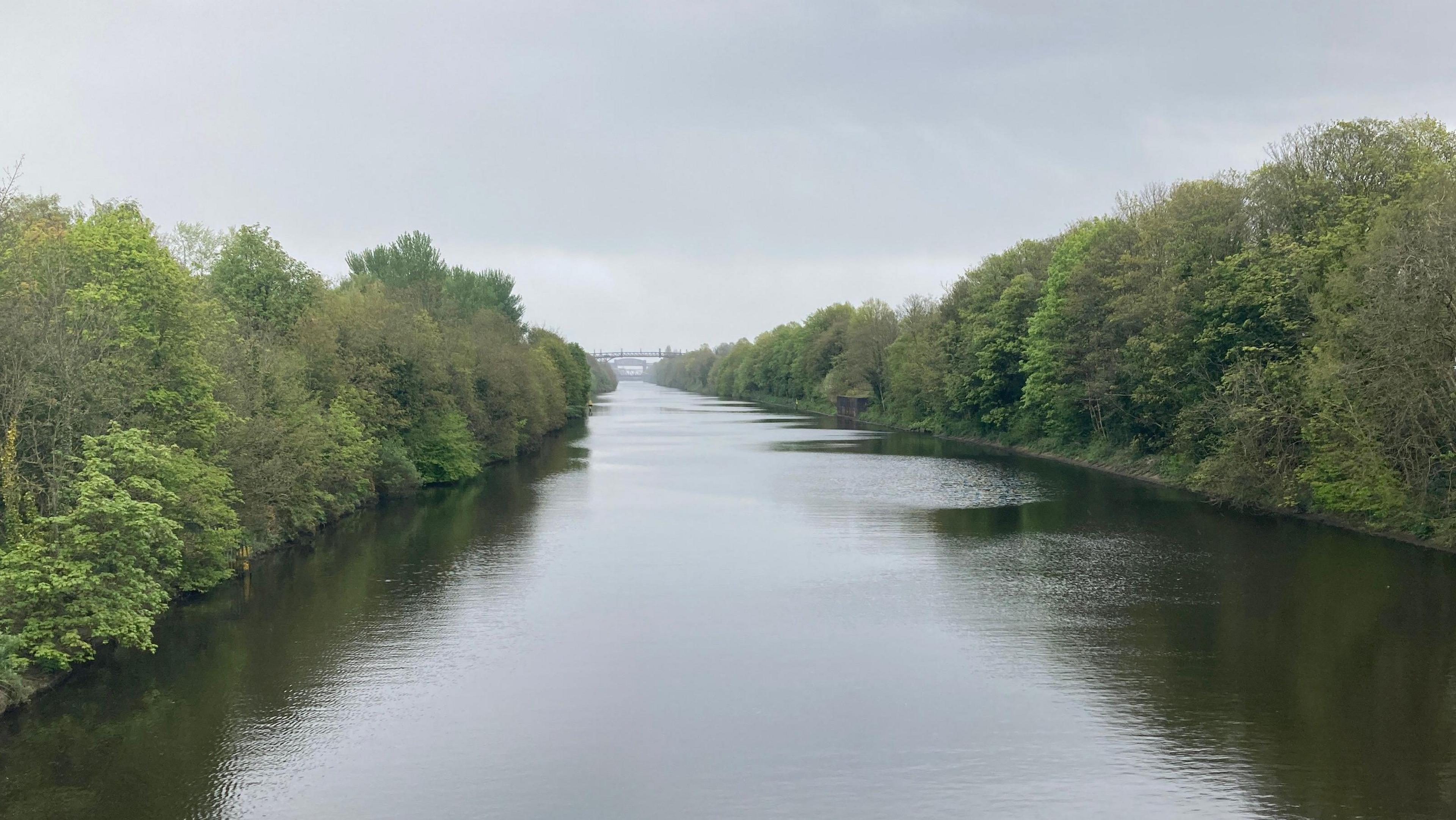 View of the Manchester Ship Canal from the Stockton Heath swing bridge in Warrington, Cheshire.