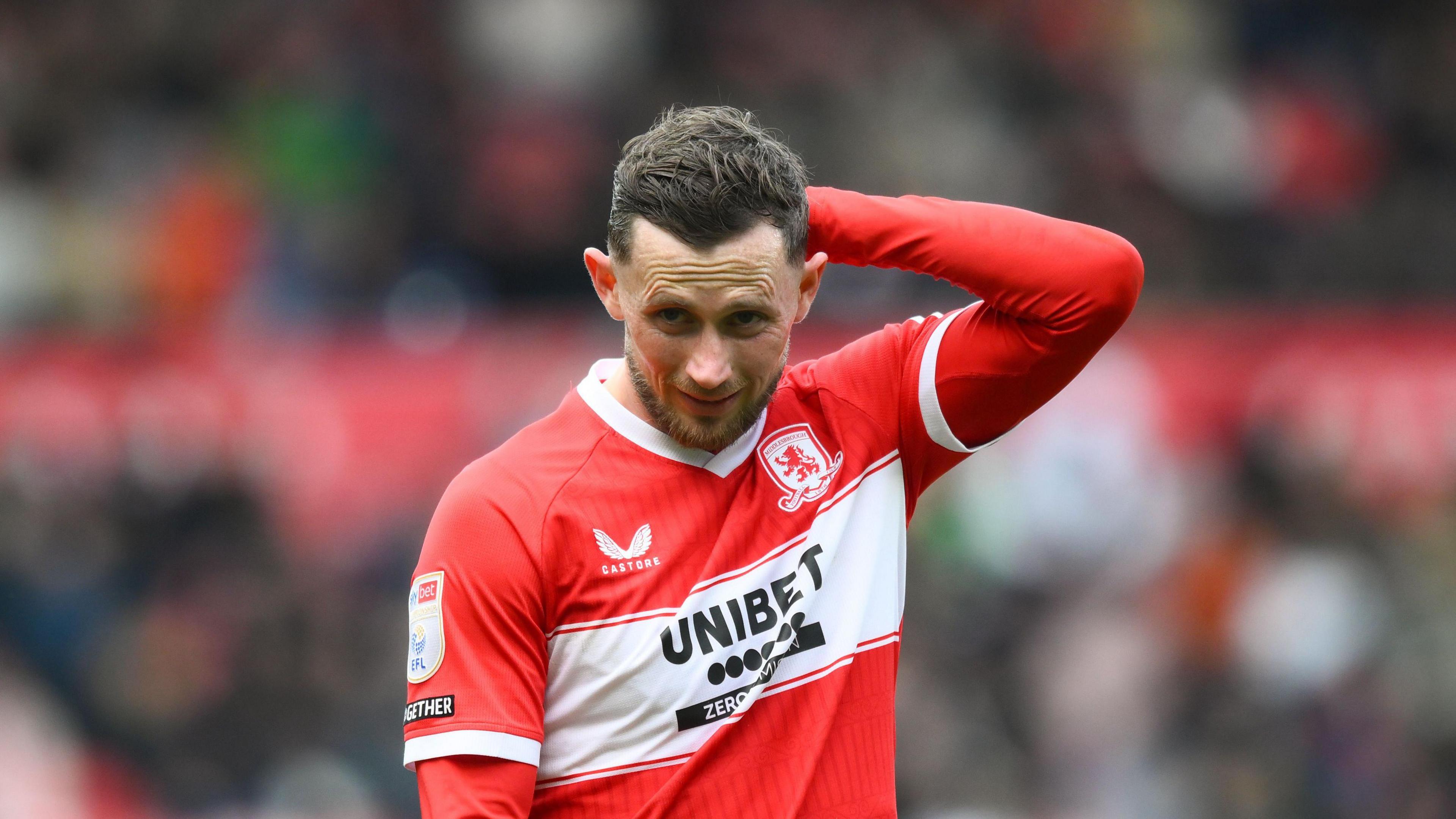 Middlesbrough midfielder Alan Browne holding his head and with an anxious look on his face the game with Portsmouth 