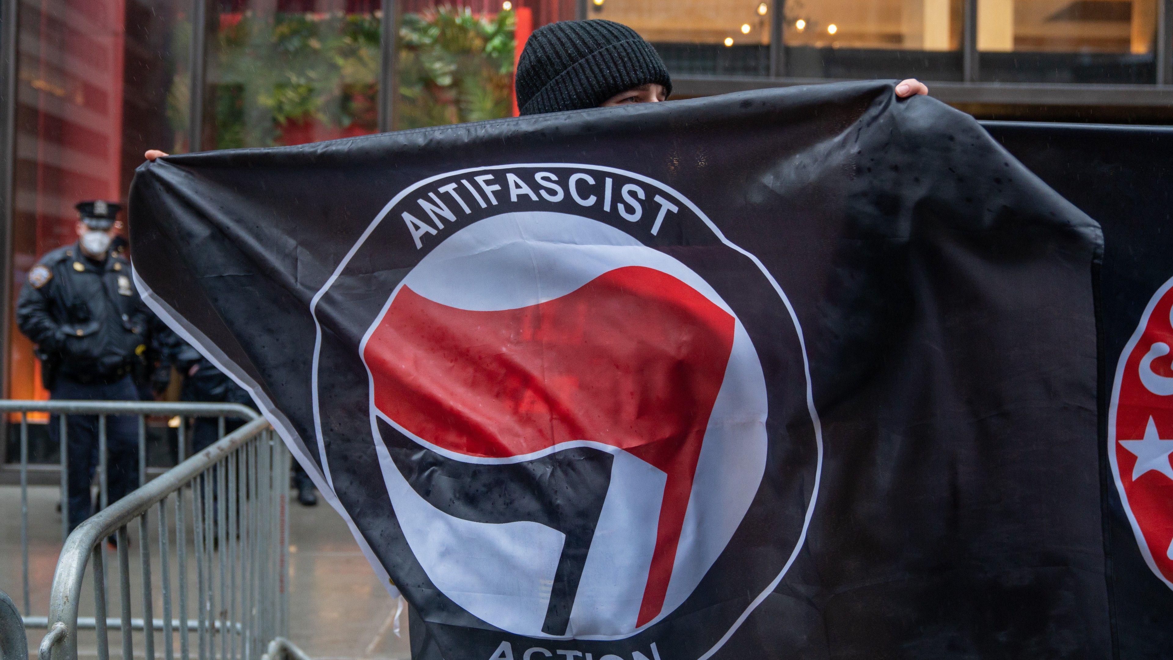 A logo featuring black and red flags is widely associated with Antifa  