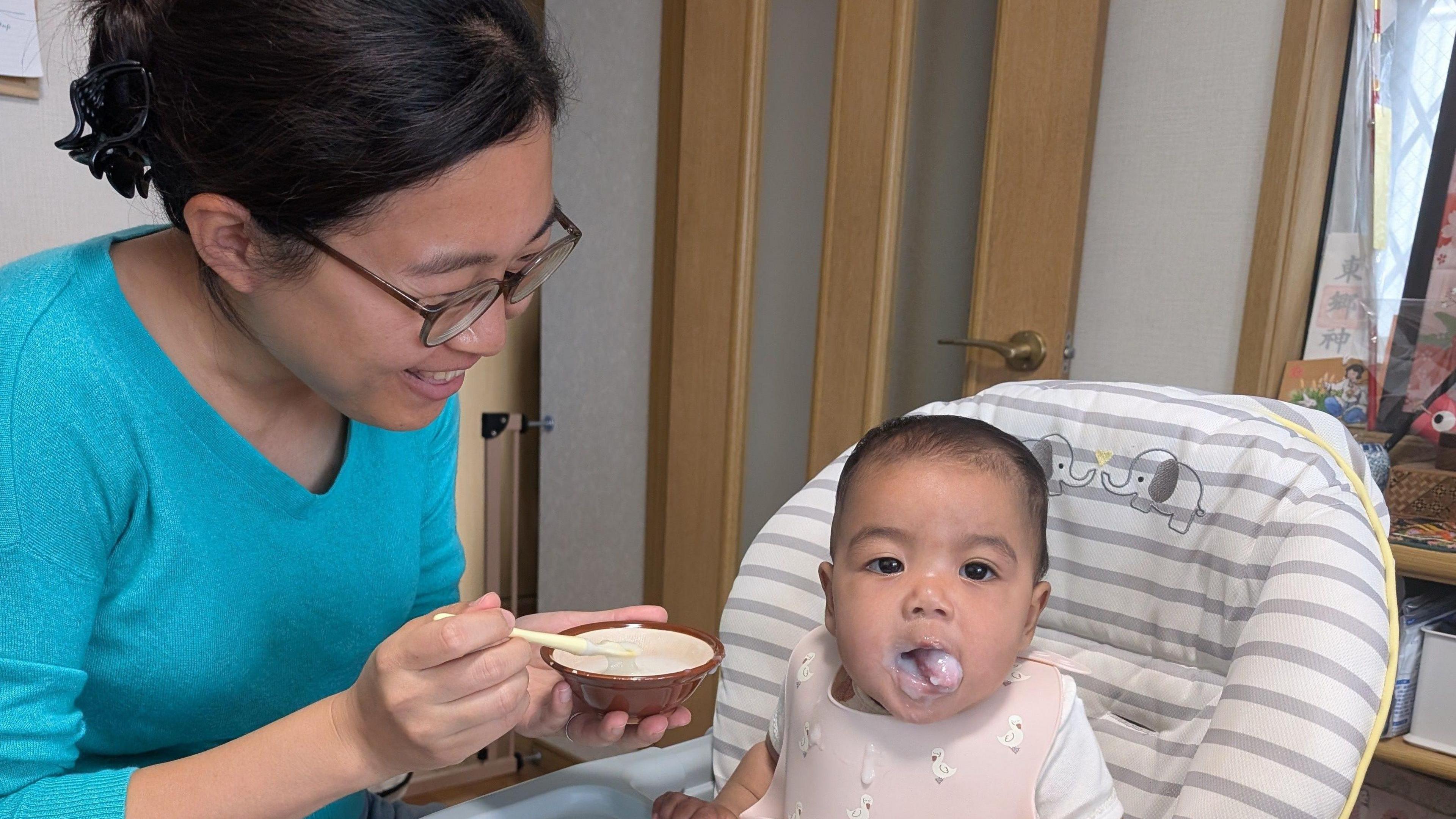 Memori Higuchi feeding her 7-month-old baby.