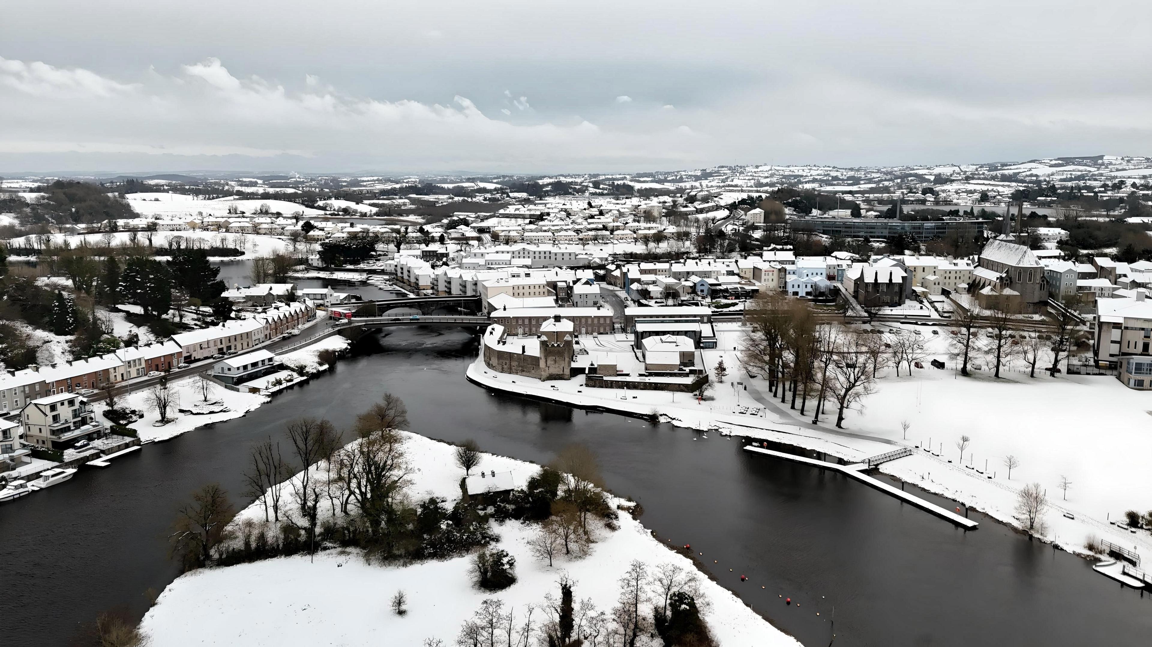 A blanket of snow covers the buildings and fields of Enniskillen