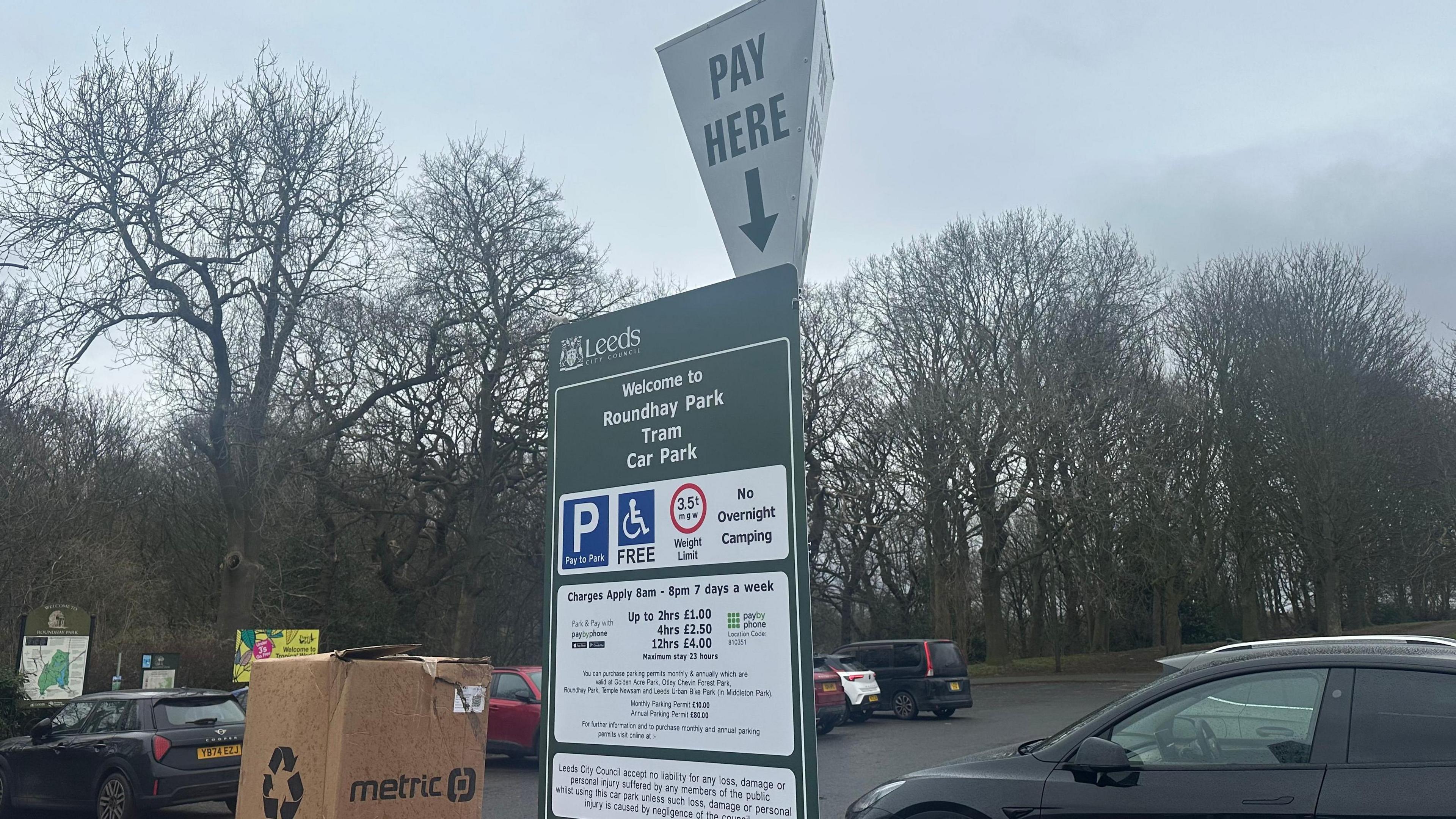 A parking sign at Roundhay Park in Leeds with the parking charges outlined