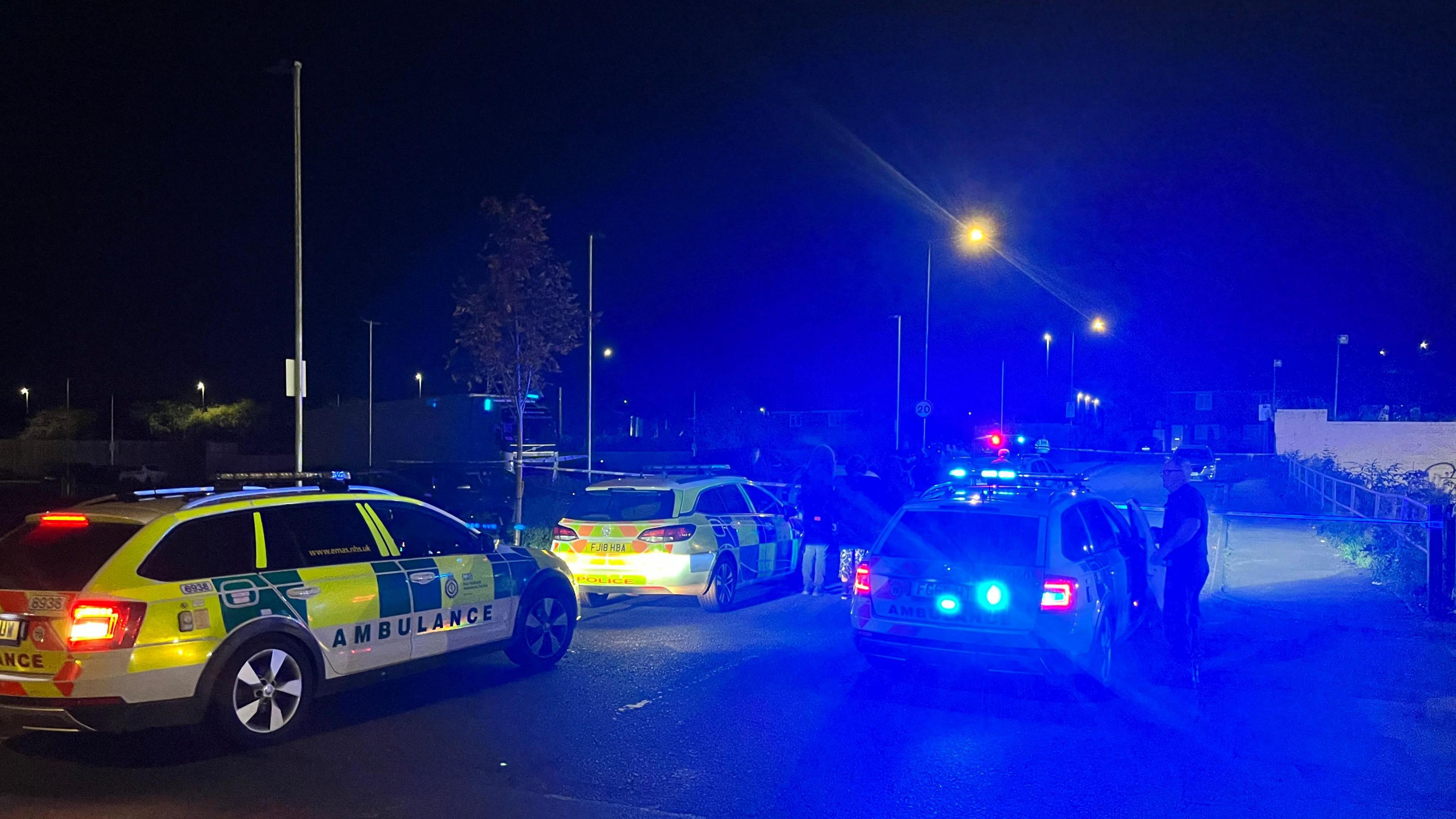 A photo of police cars on Marmion Road in Thorneywood, Nottinghamshire. An ambulance is also at the scene and a police cordon is visible in the background.