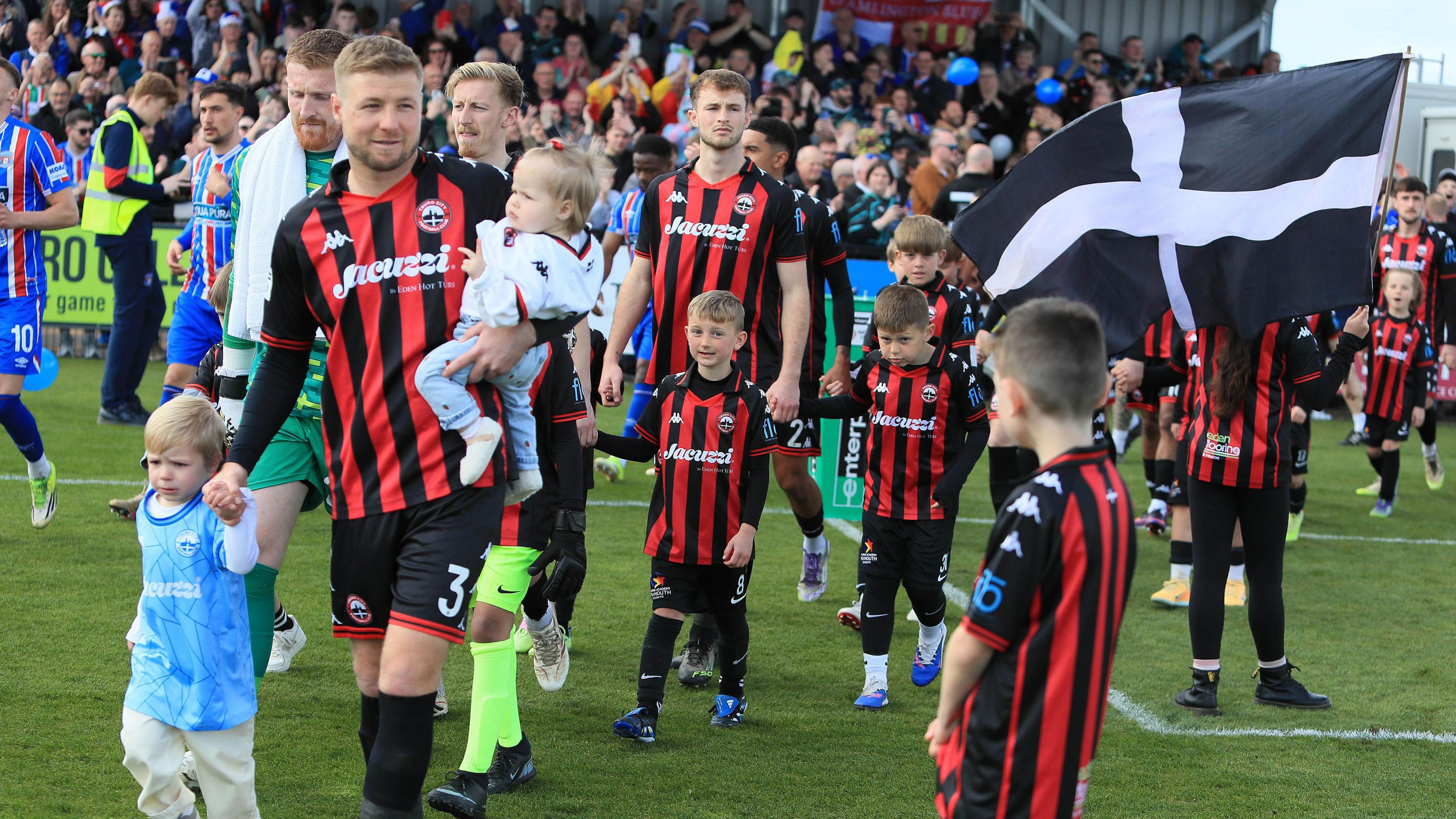 Truro City players walk out for final game of season.