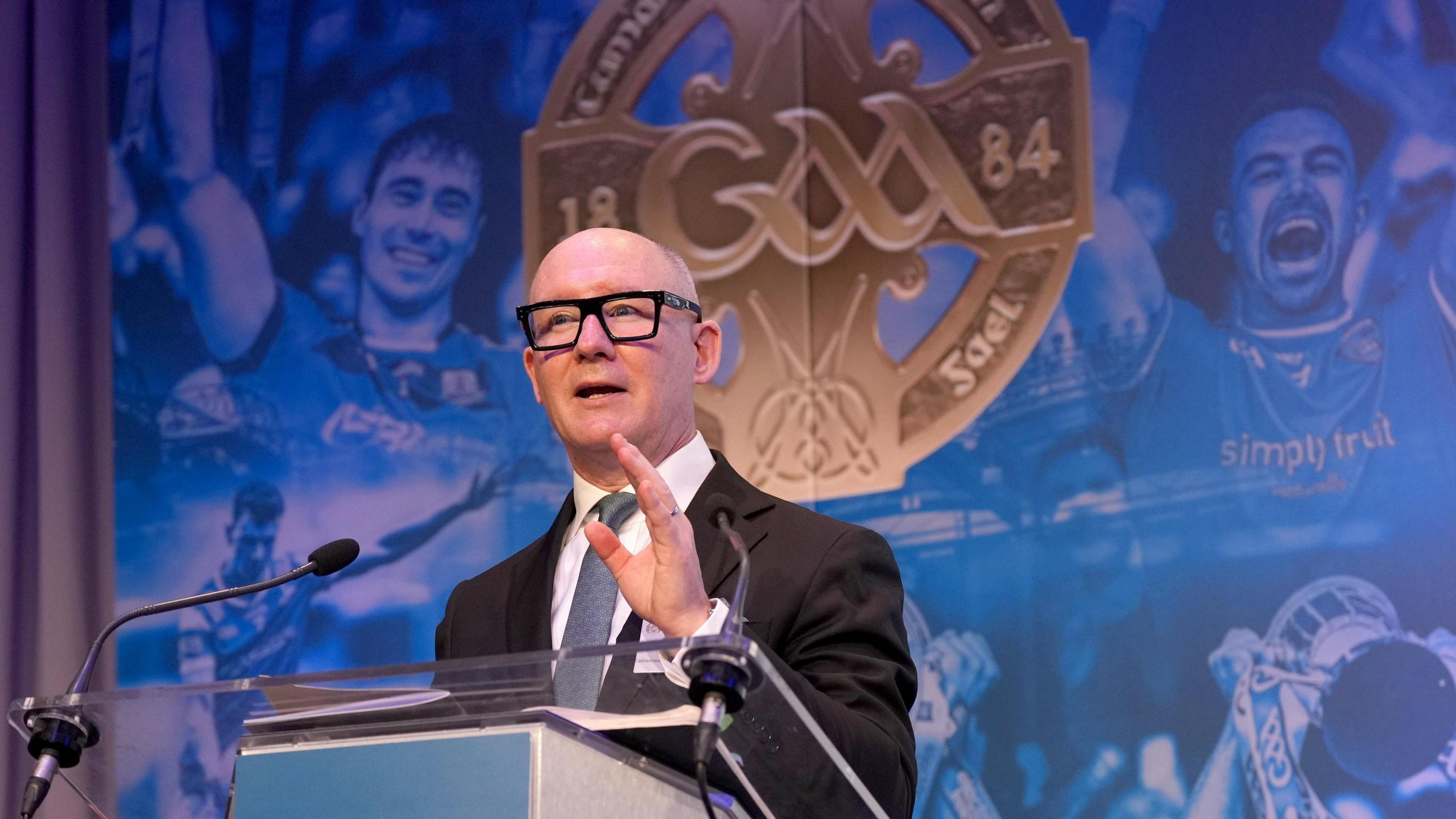 Football review committee chairman Jim Gavin on stage at GAA congress speaking to the crowd.