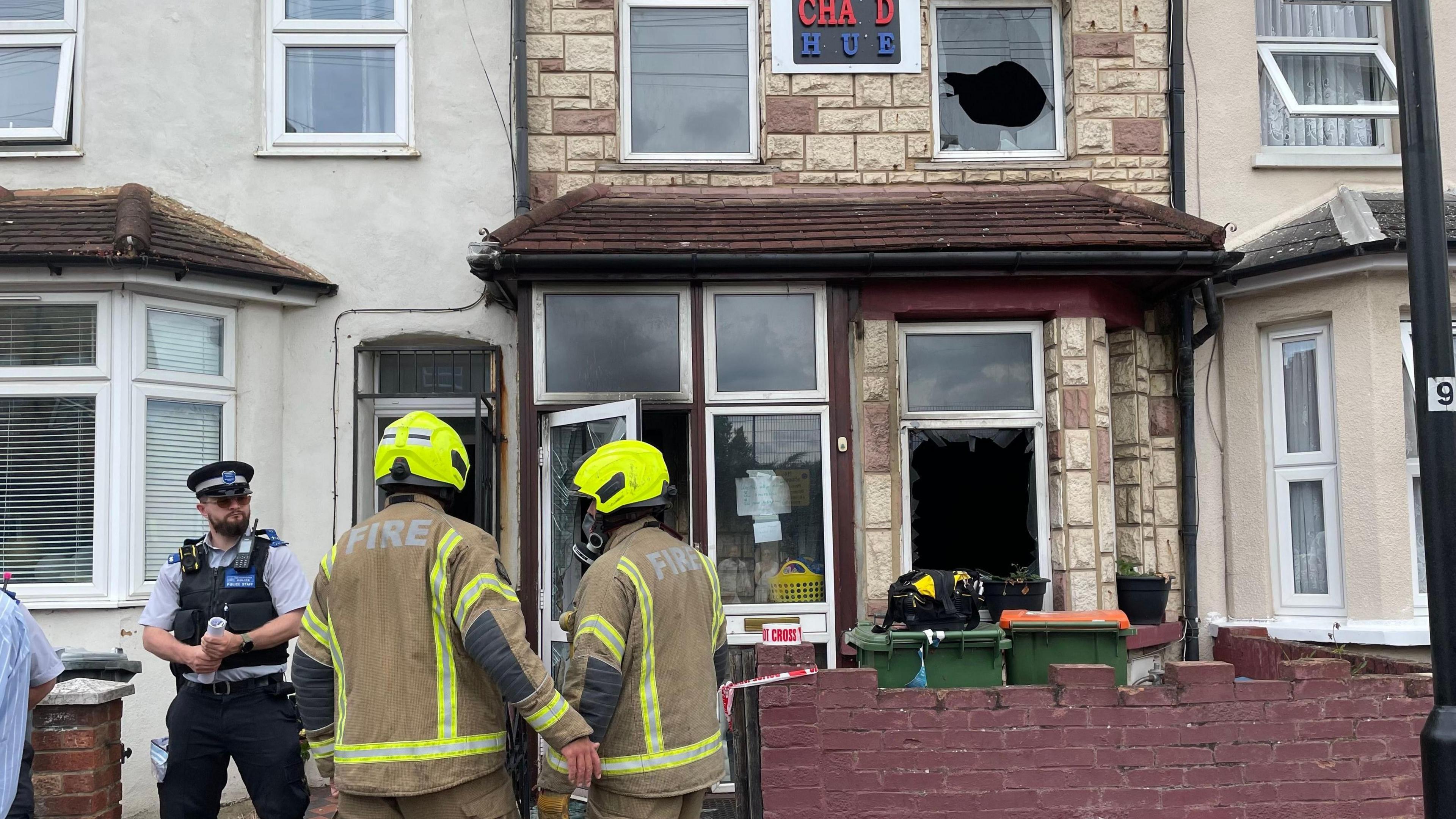 Firefighters outside house