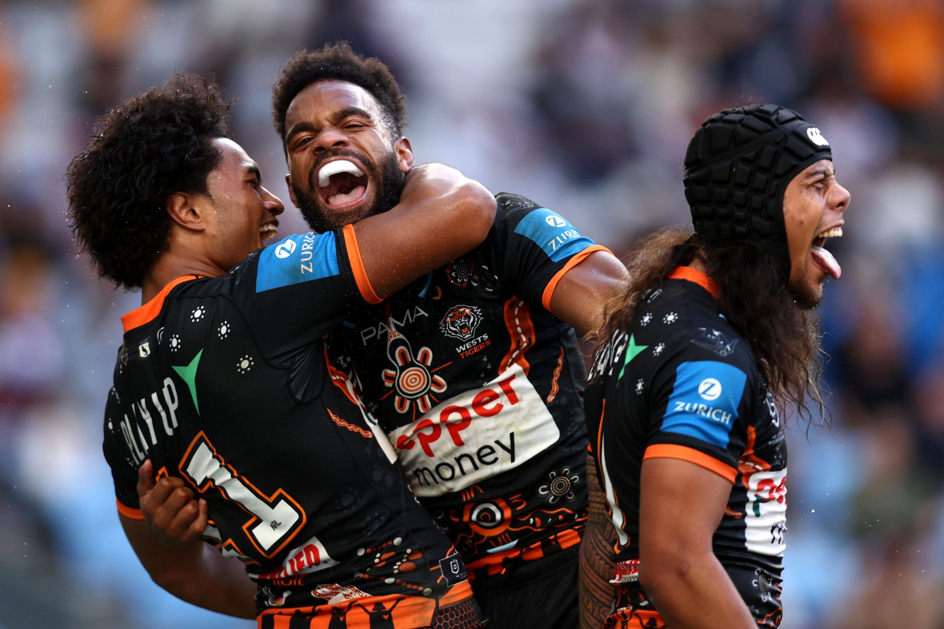 Wests Tigers' Sunia Turuva celebrates after scoring a try during the round 24 NRL match between Wests Tigers and Manly Sea Eagles at Allianz Stadium, in Sydney, Australia. Photo by Jason McCawley