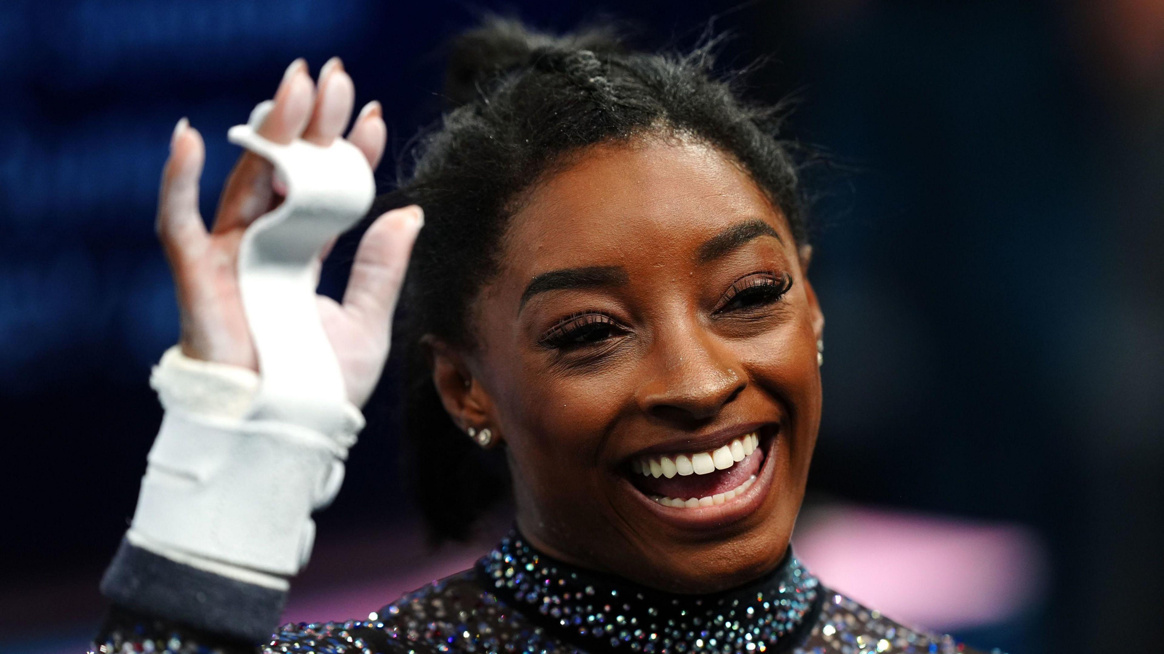 Simone Biles smiling at the Paris 2024 Olympics