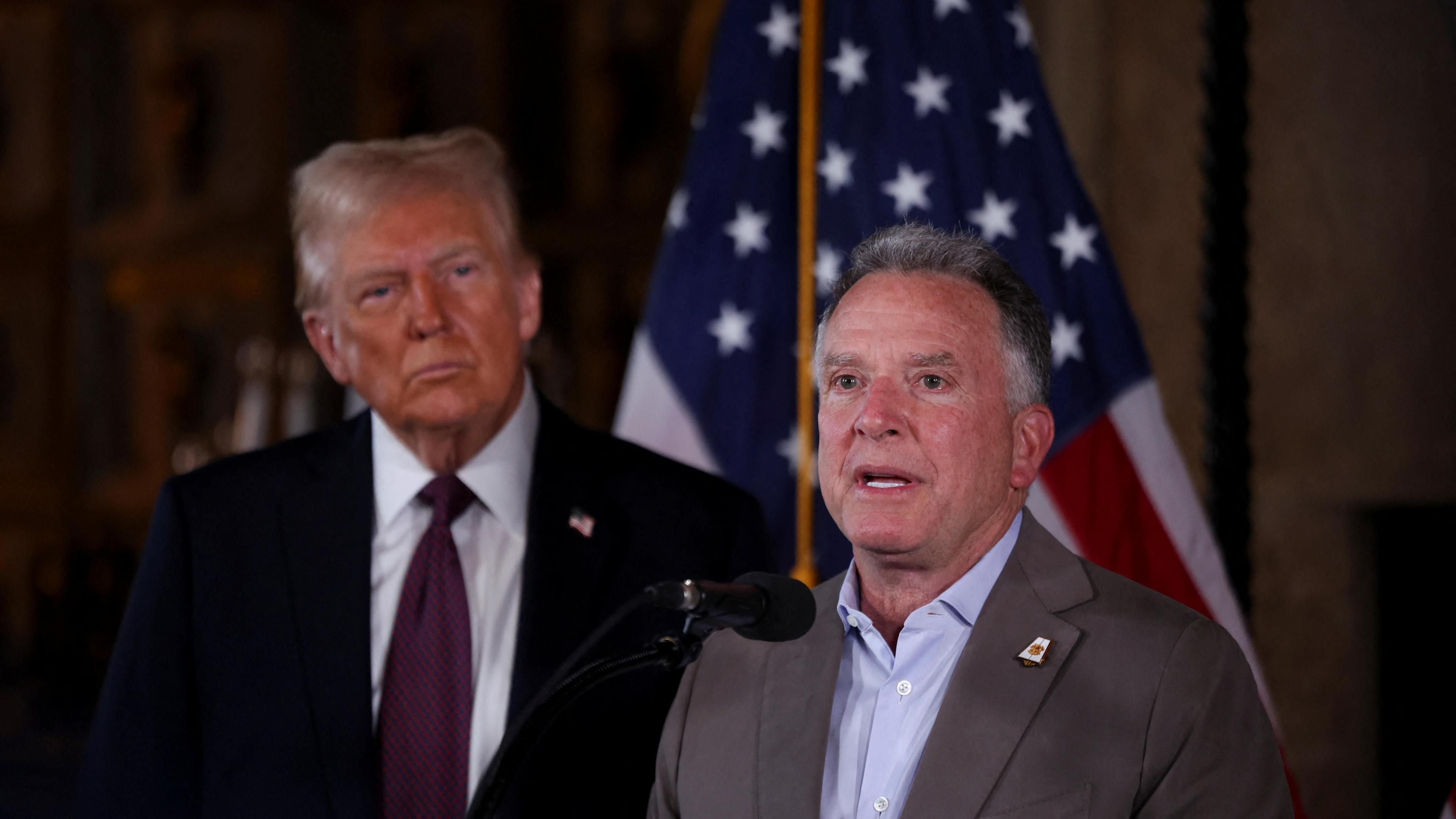 US President-elect Donald Trump (L) watches as his Middle East envoy Steve Witkoff (R) speaks at a news conference at Mar-a-Lago, Florida, US (7 January 2025)