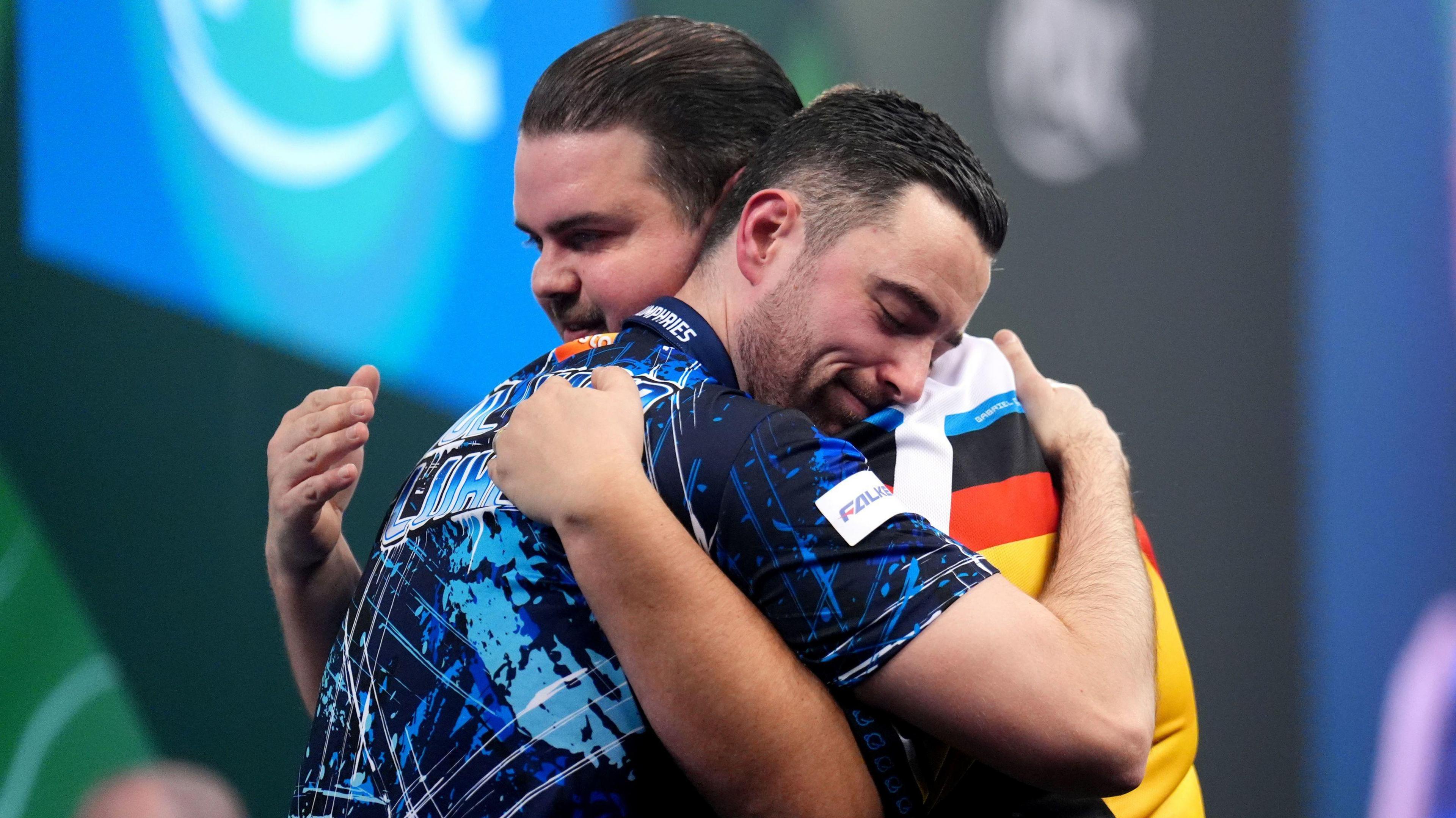 England's Luke Humphries celebrates defeating Germany's Gabriel Clemens on day fifteen of the Paddy Power World Darts Championship at the Alexandra Palace, London