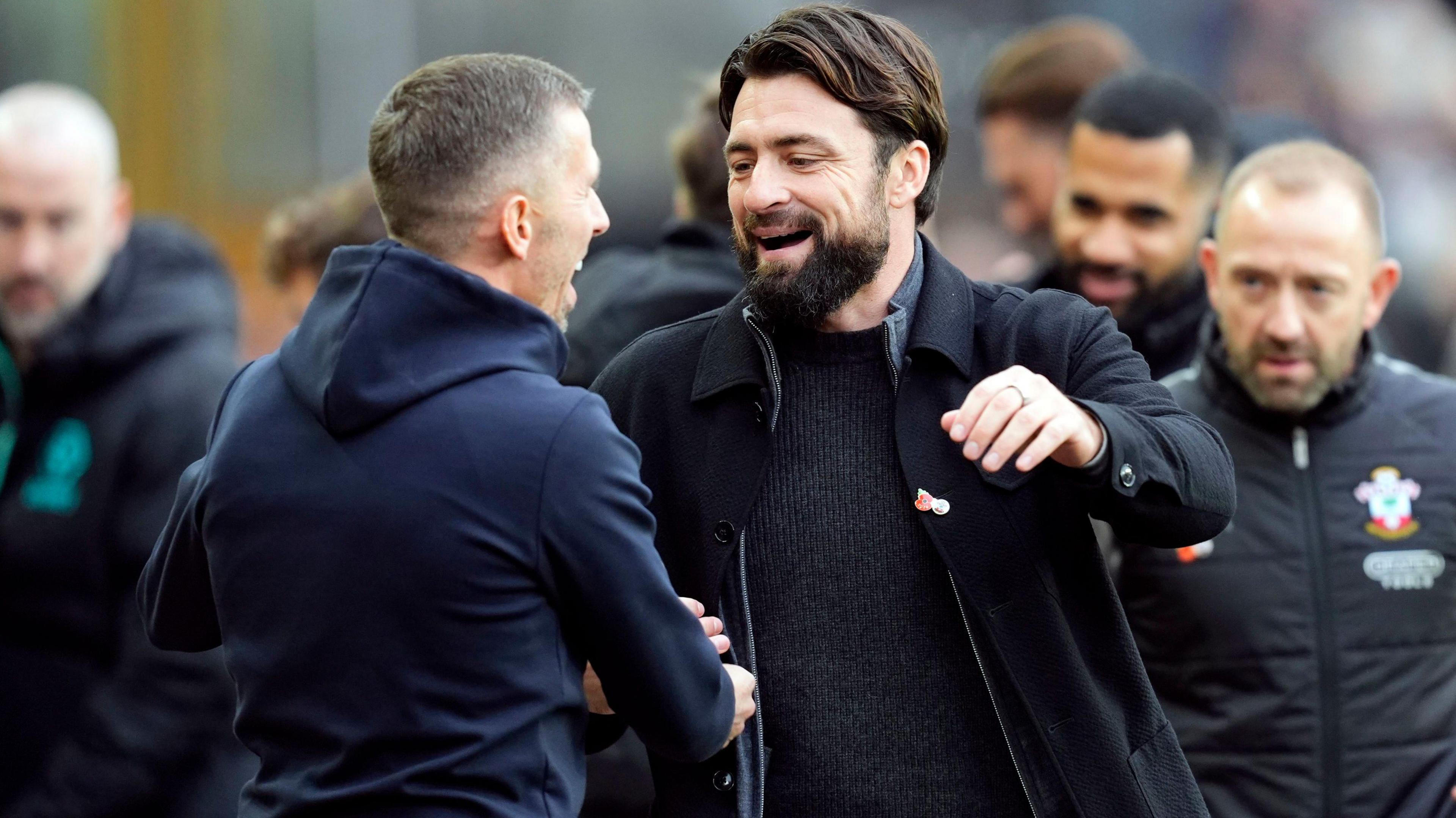 Gary O'Neil and Russell Martin greet each other