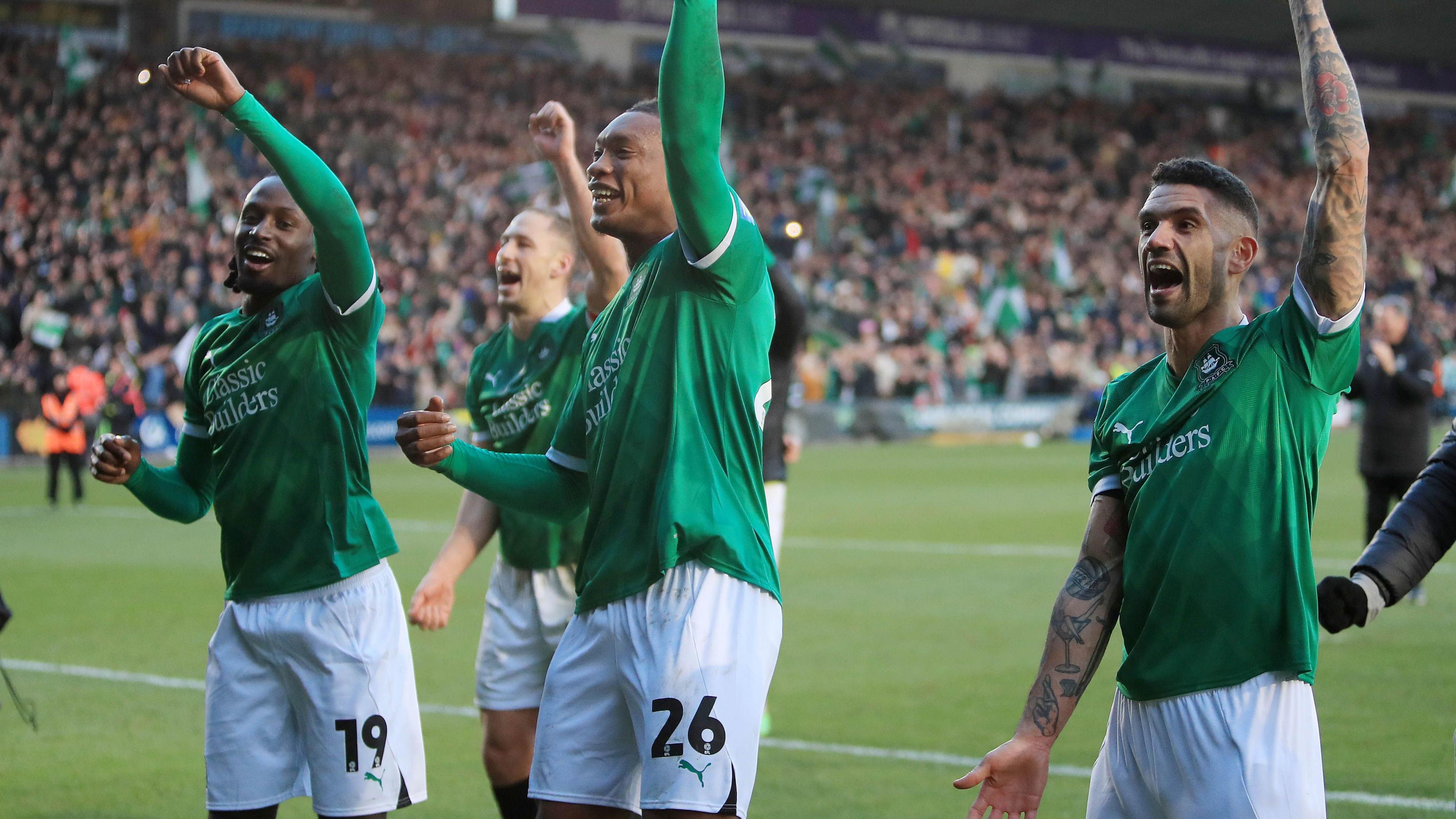 Plymouth Argyle players celebrate beating Liverpool