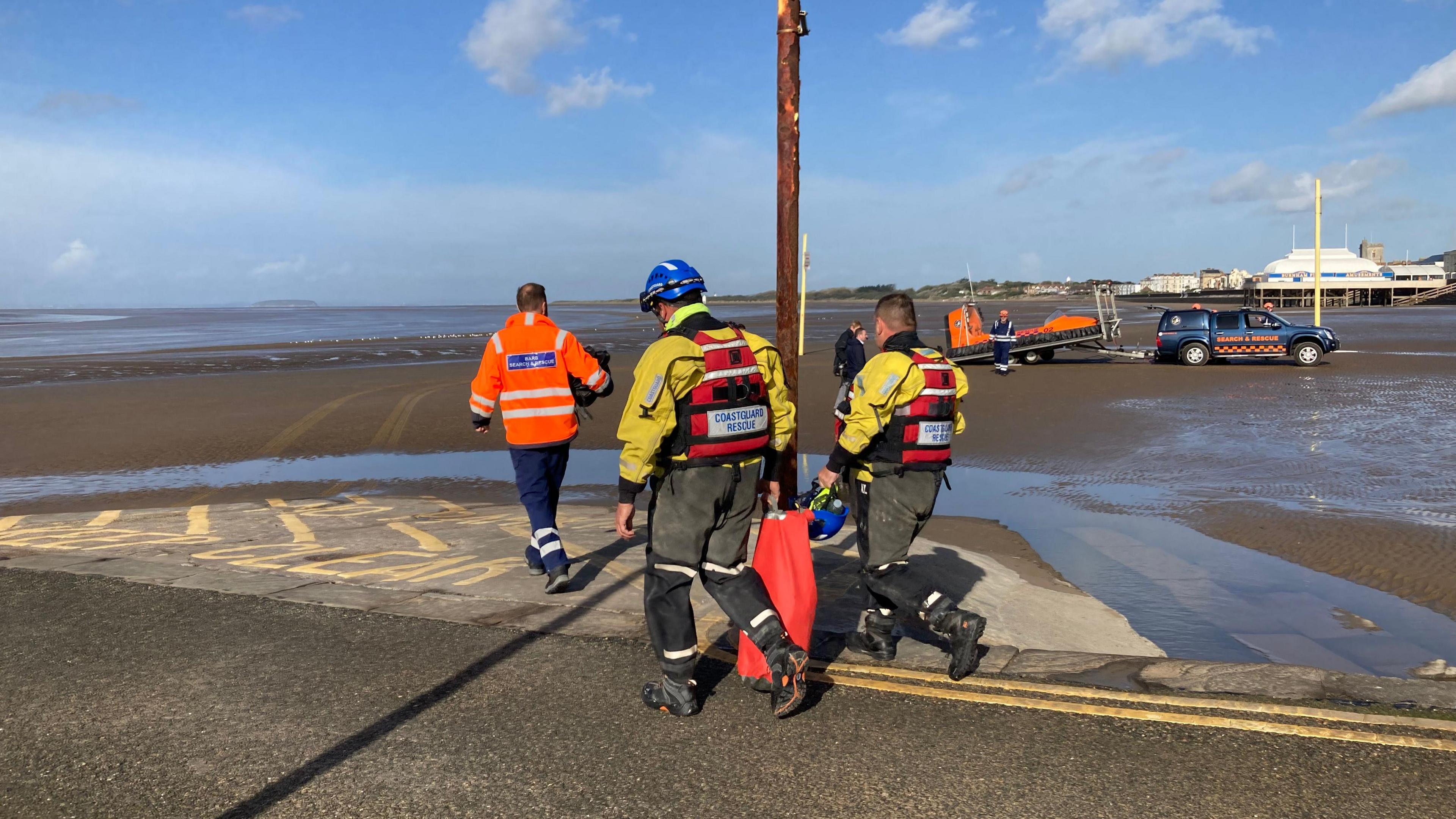 Search teams on the beach in Burnham-on-Sea