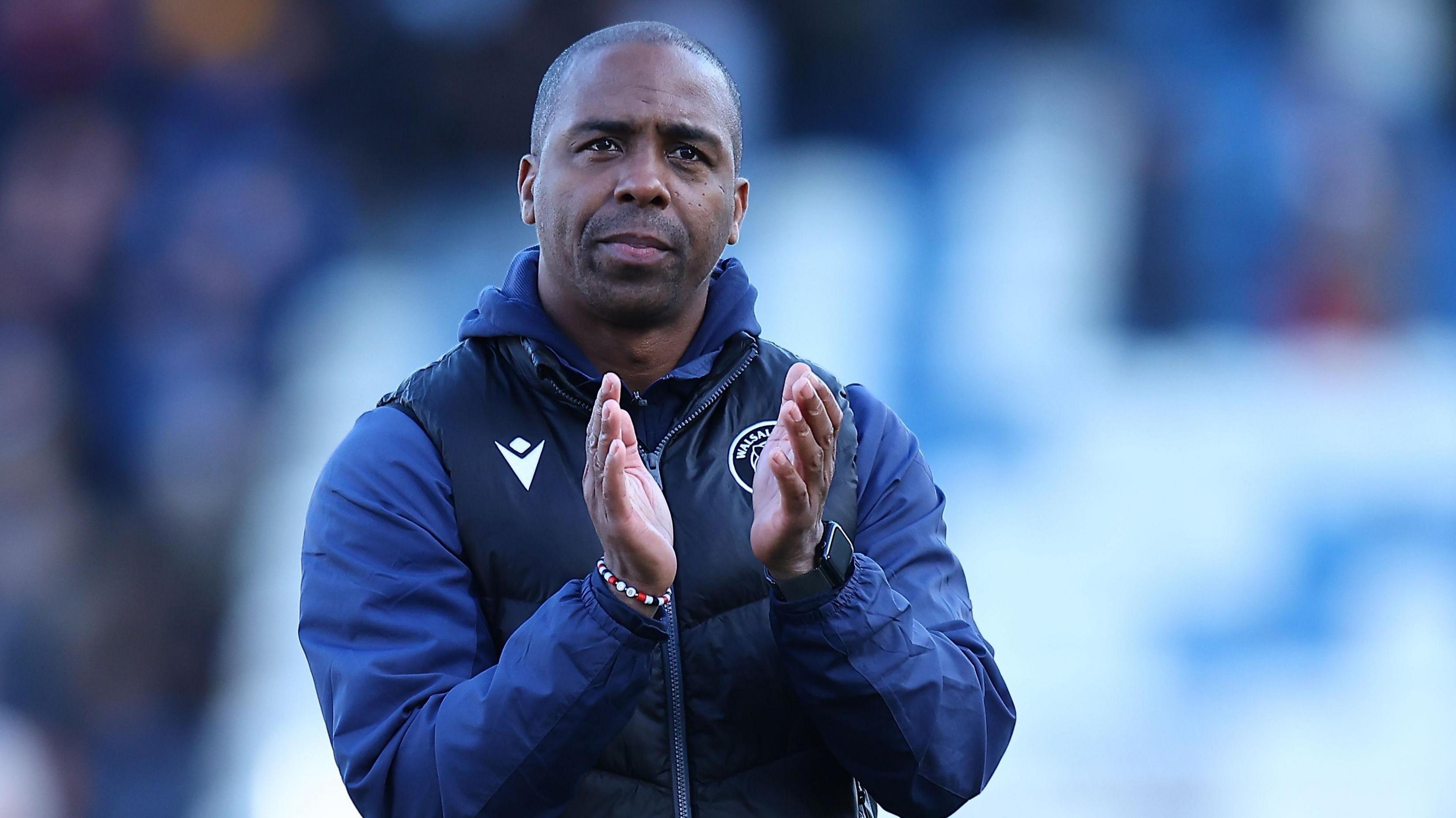 Darren Byfield claps the crowd after a game