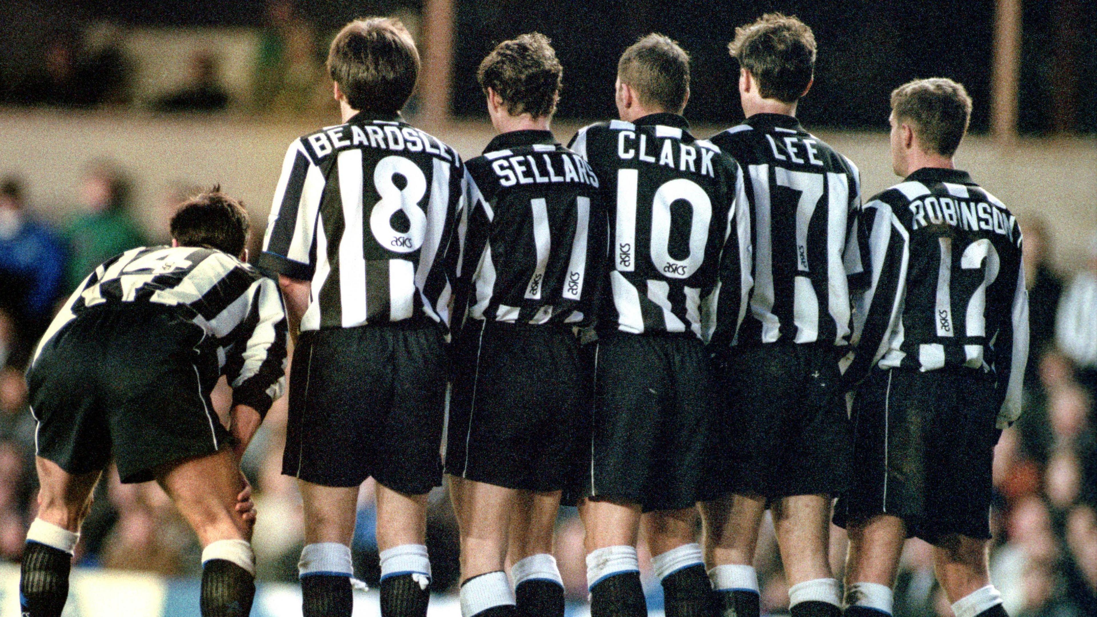 Newcastle players line up for a wall