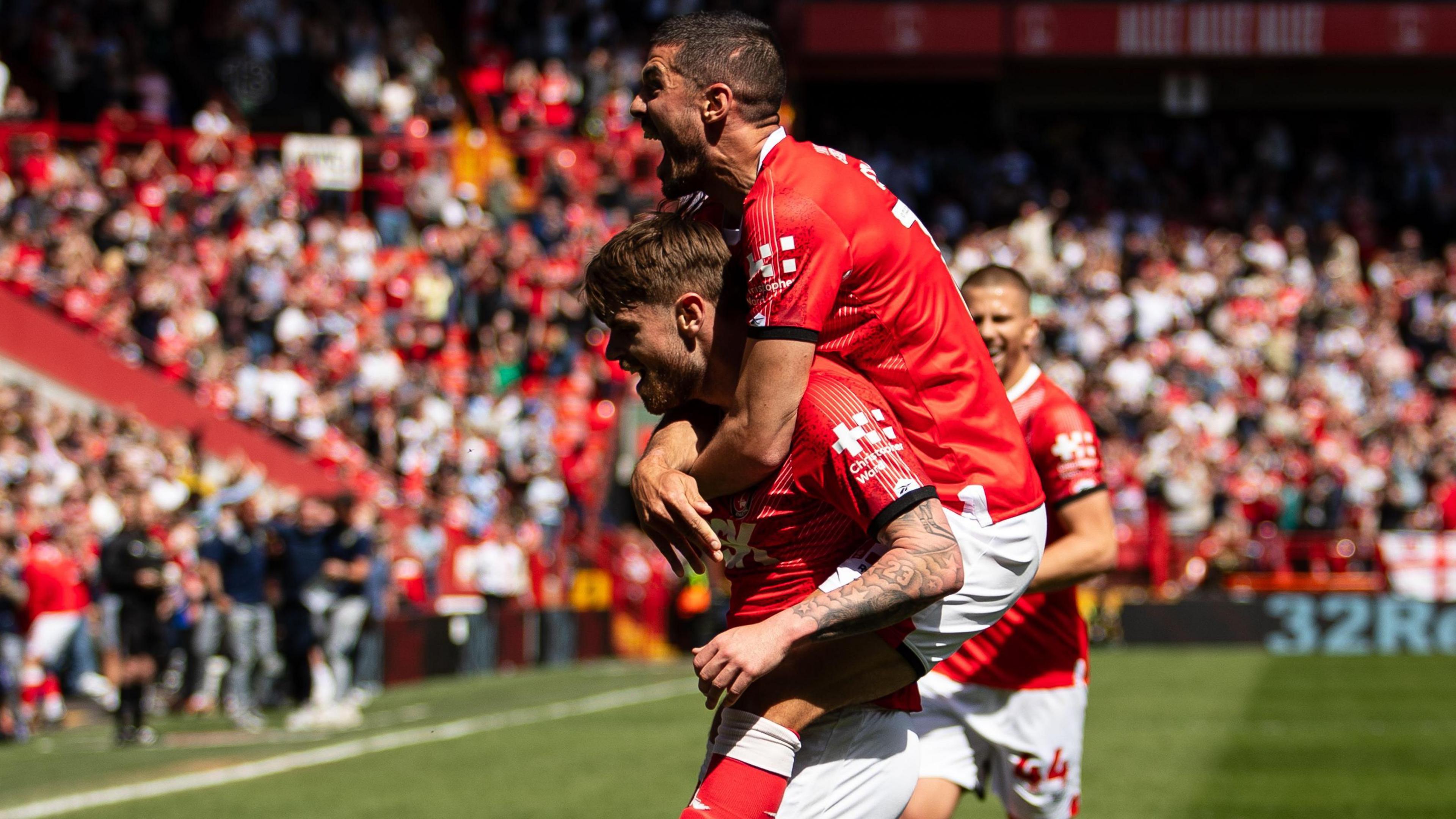 Charlie Kelman is mobbed after scoring Charlton's opening goal against Hull City at The Valley