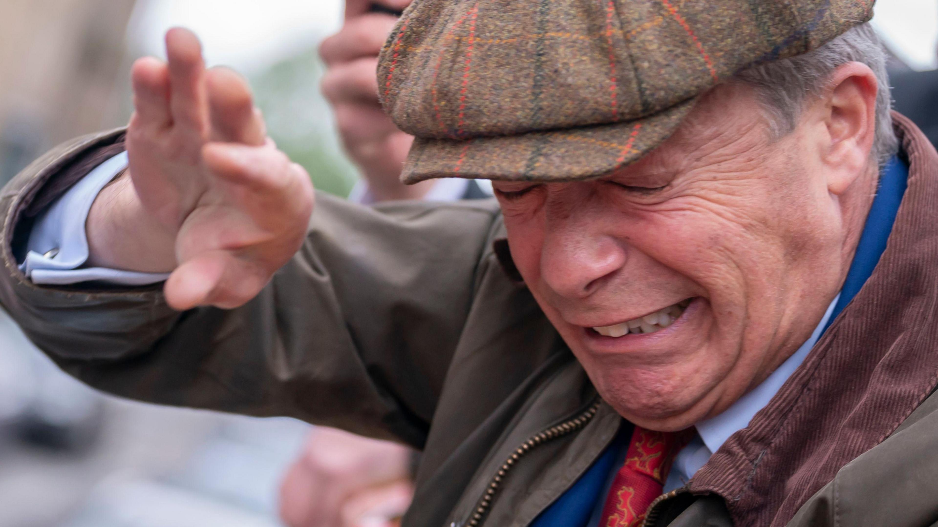 Nigel Farage is struck with a coffee cup during a visit to Barnsley