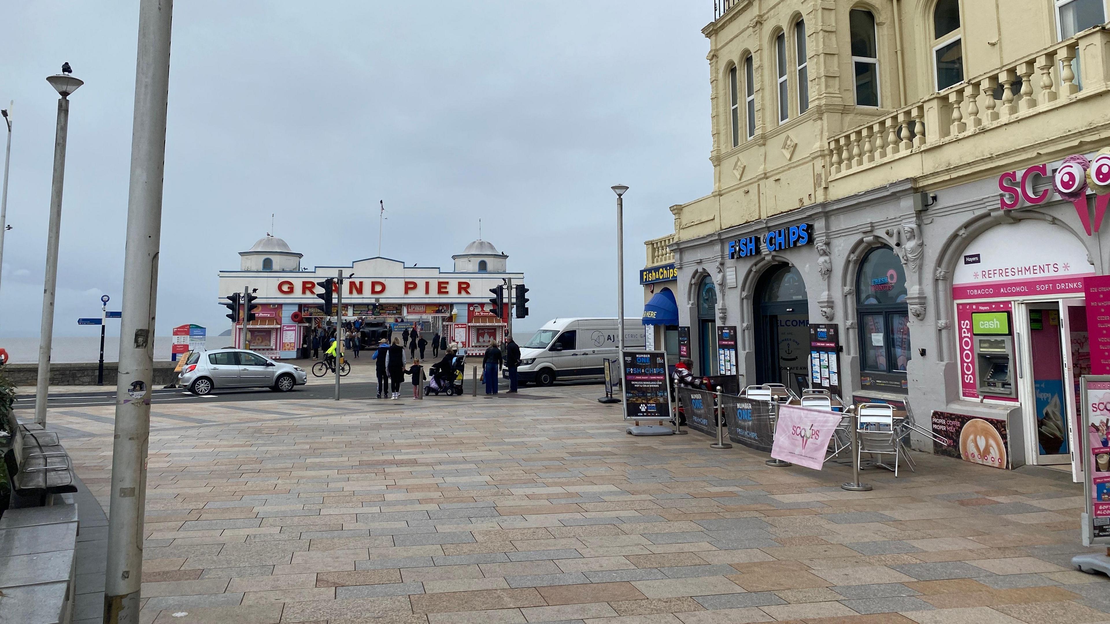 A view of the outside of the restaurant with the pier in the background. The restaurant doesn't have any seating outside of it anymore.