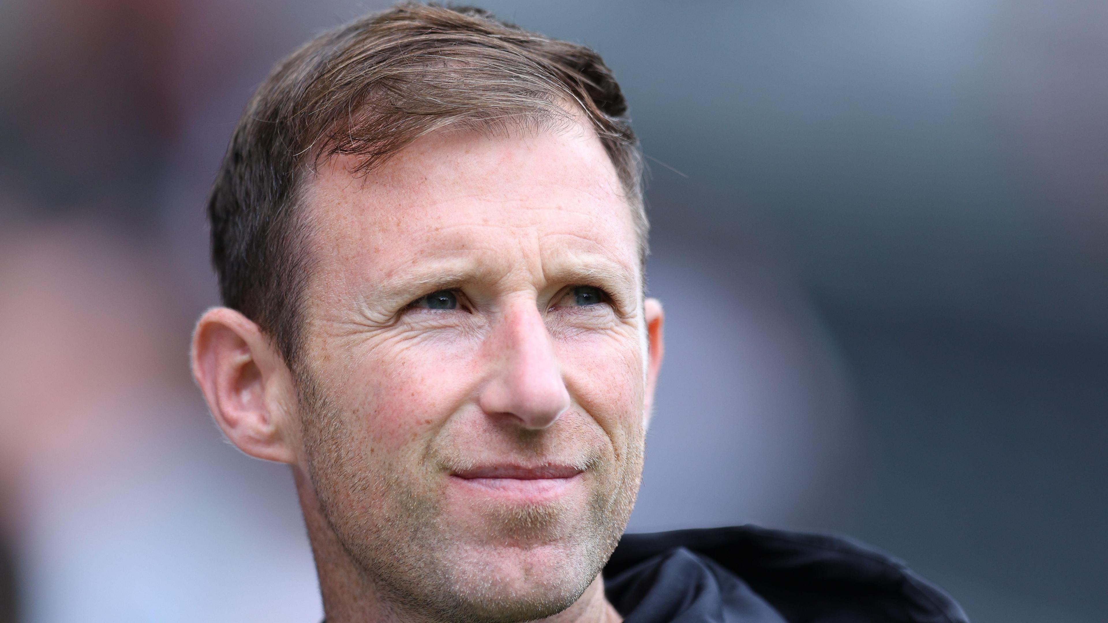 Carlisle head coach Mike Williamson stood on the touchline