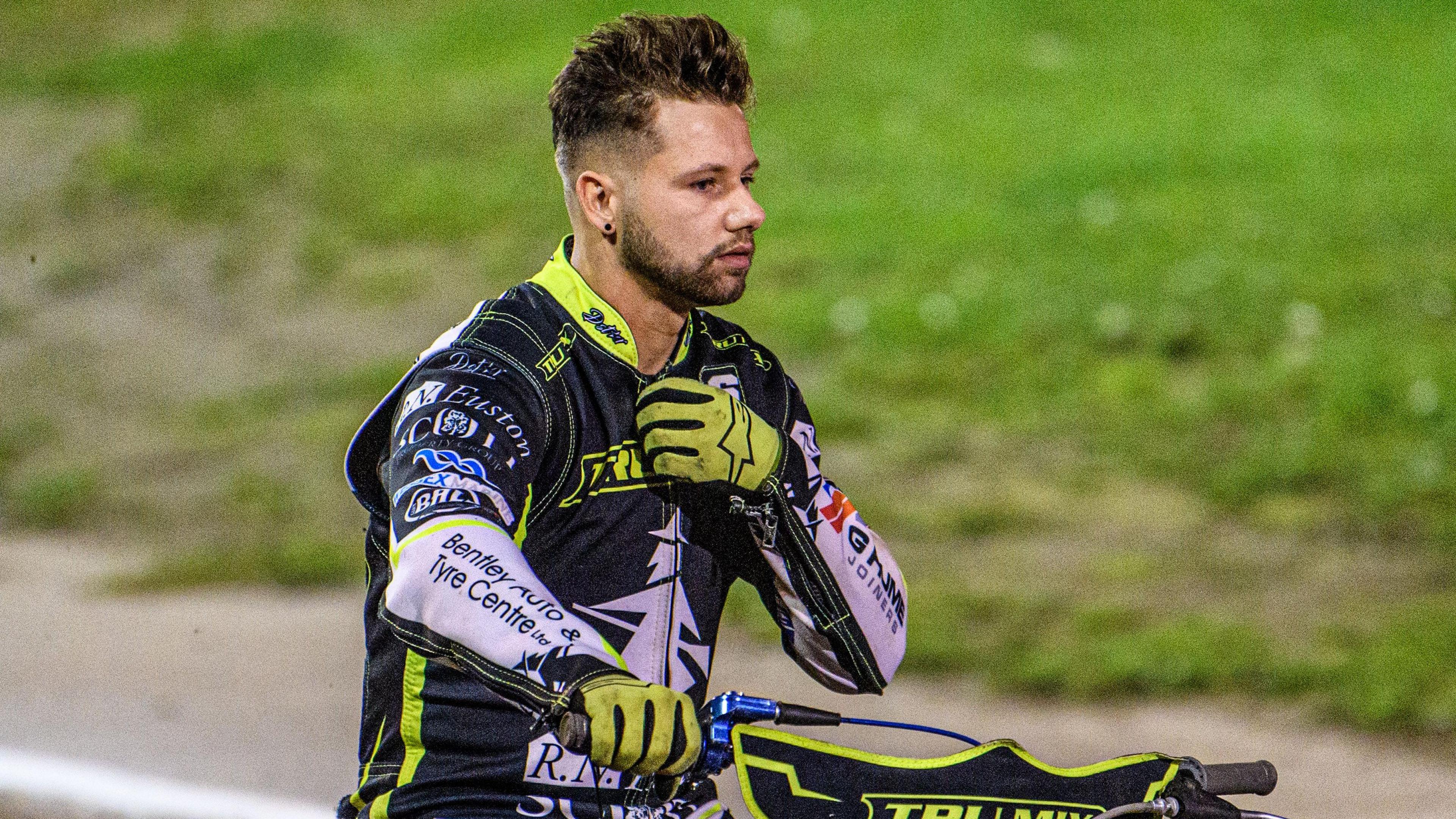 Danyon Hume on a speedway bike and wearing Ipswich Witches kevlars and gloves