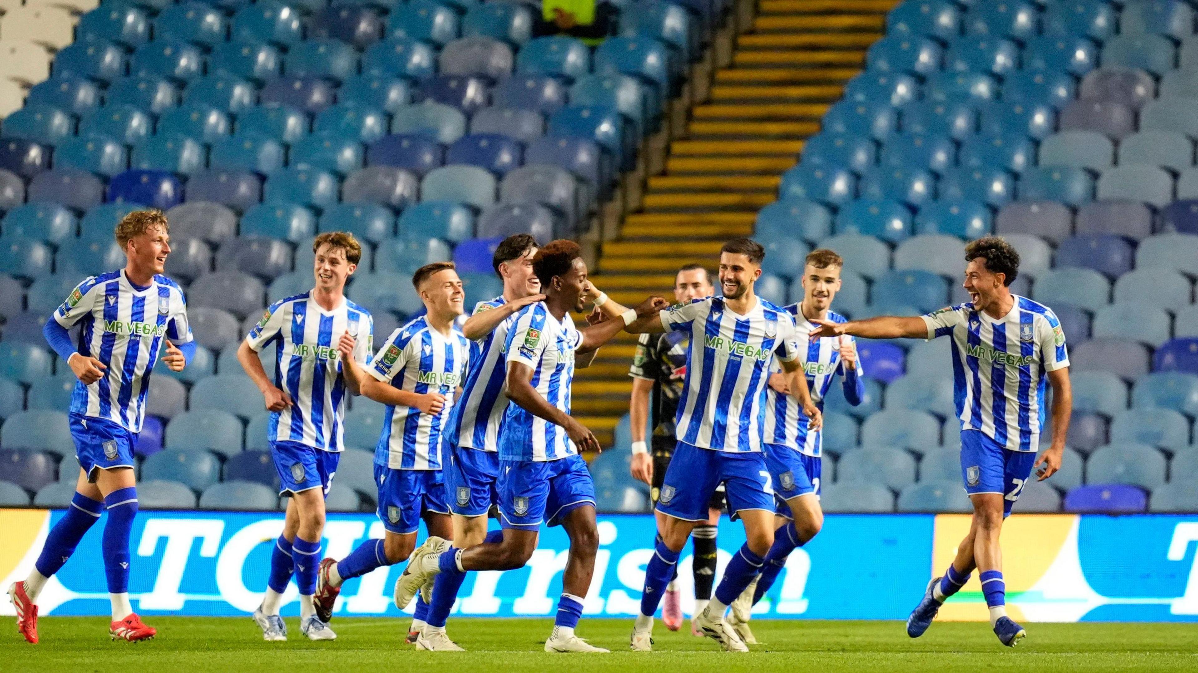 Sheffield Wednesday players celebrate scoring against Leeds