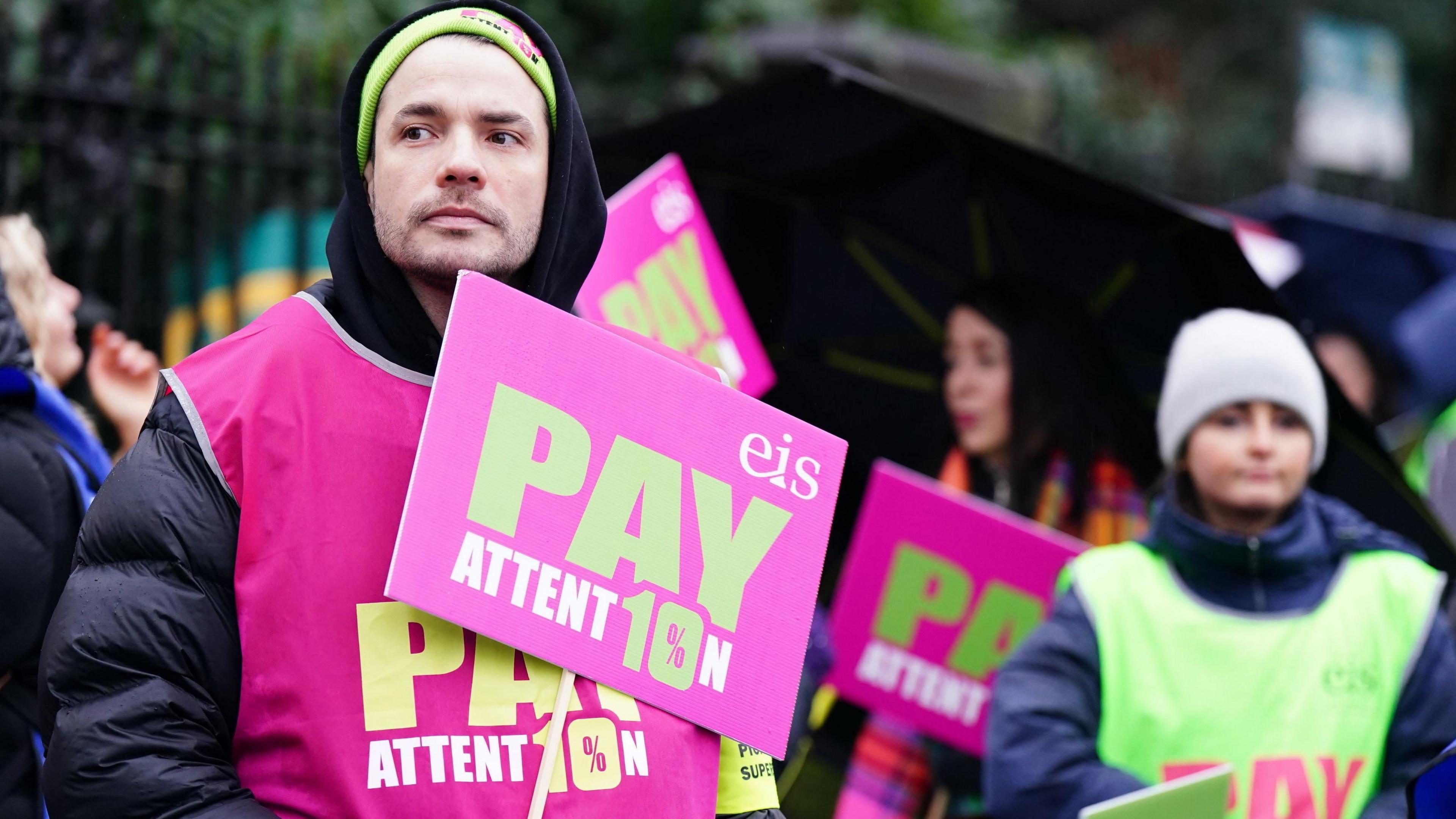 Library image of protesters with placards on a primary school teachers'  picket line outside Wellshot Primary School in Glasgow. 