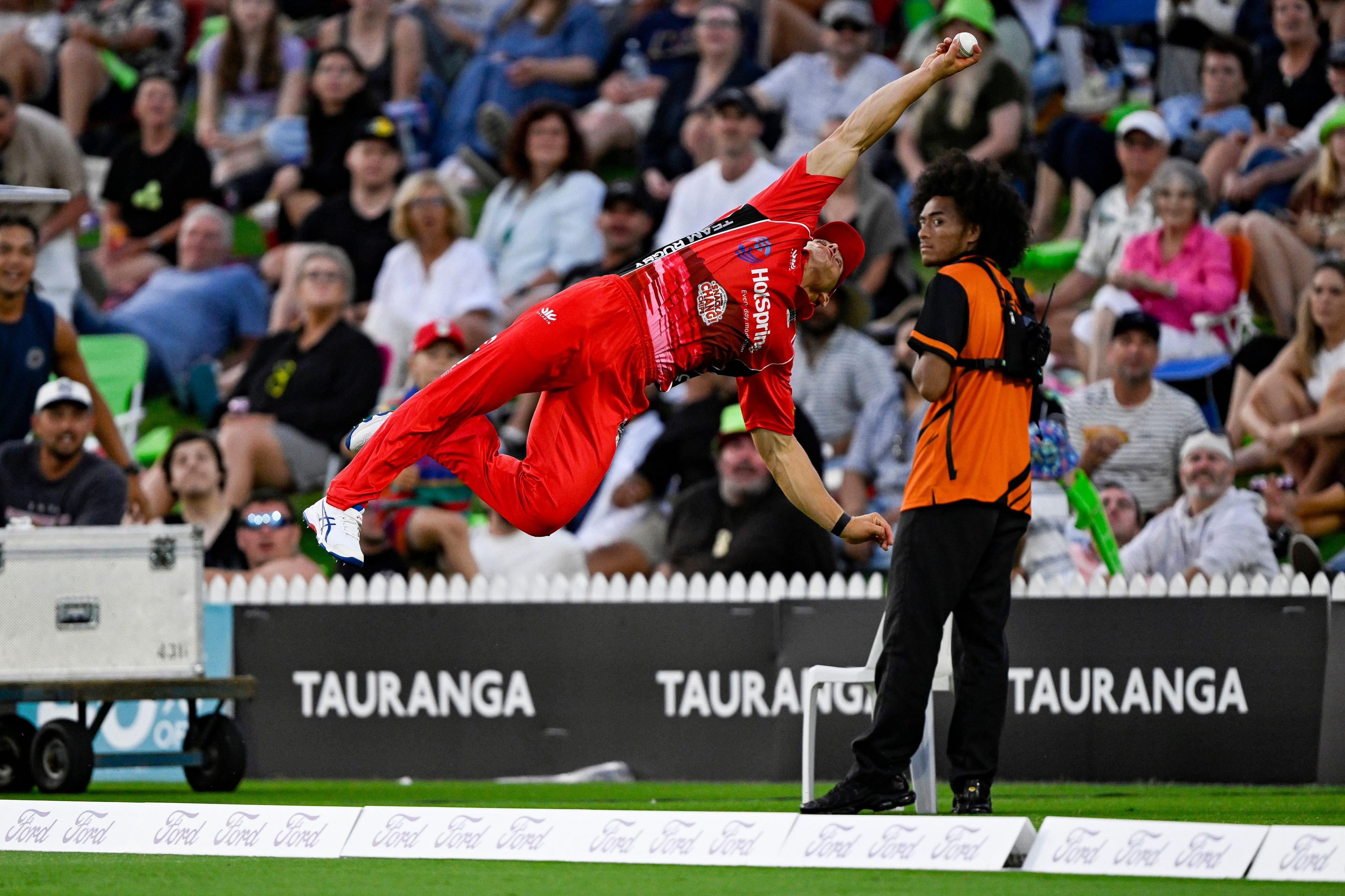 Ruben Love of Team Rugby dives over the boundary to take a one handed diving catch. Team Cricket v Team Rugby, HotSpring T20 Black Clash in association with Wolfbrook at Bay Oval, Tauranga, New Zealand on Saturday 20 January 2024