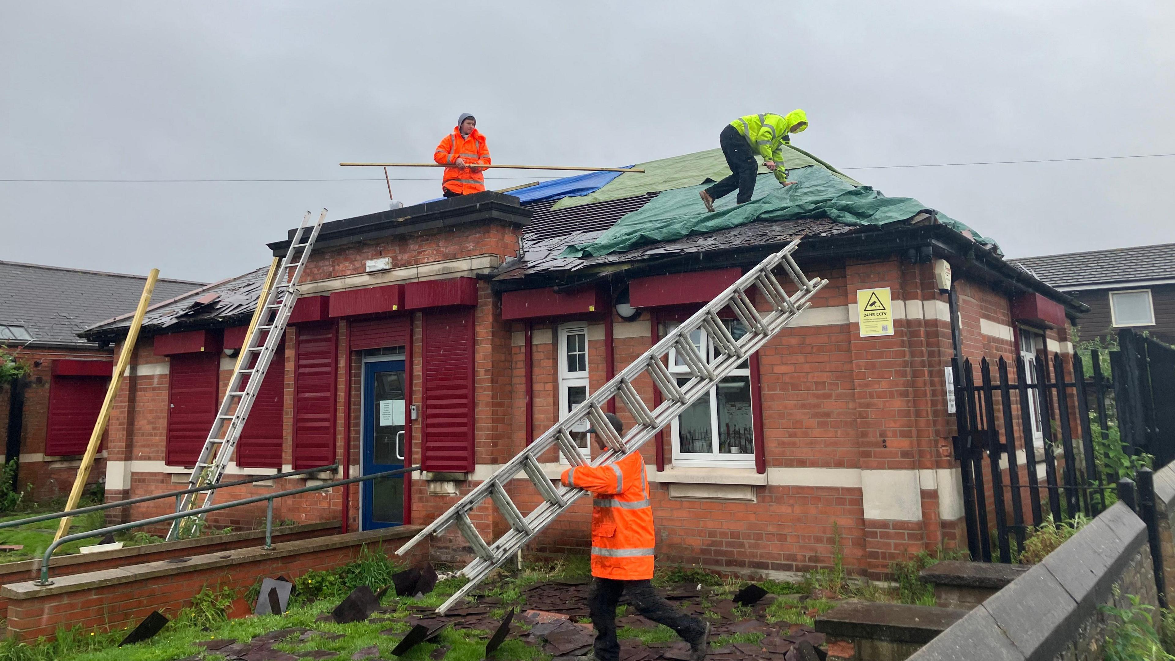 Workers on the roof at Harbour Place in Grimsby