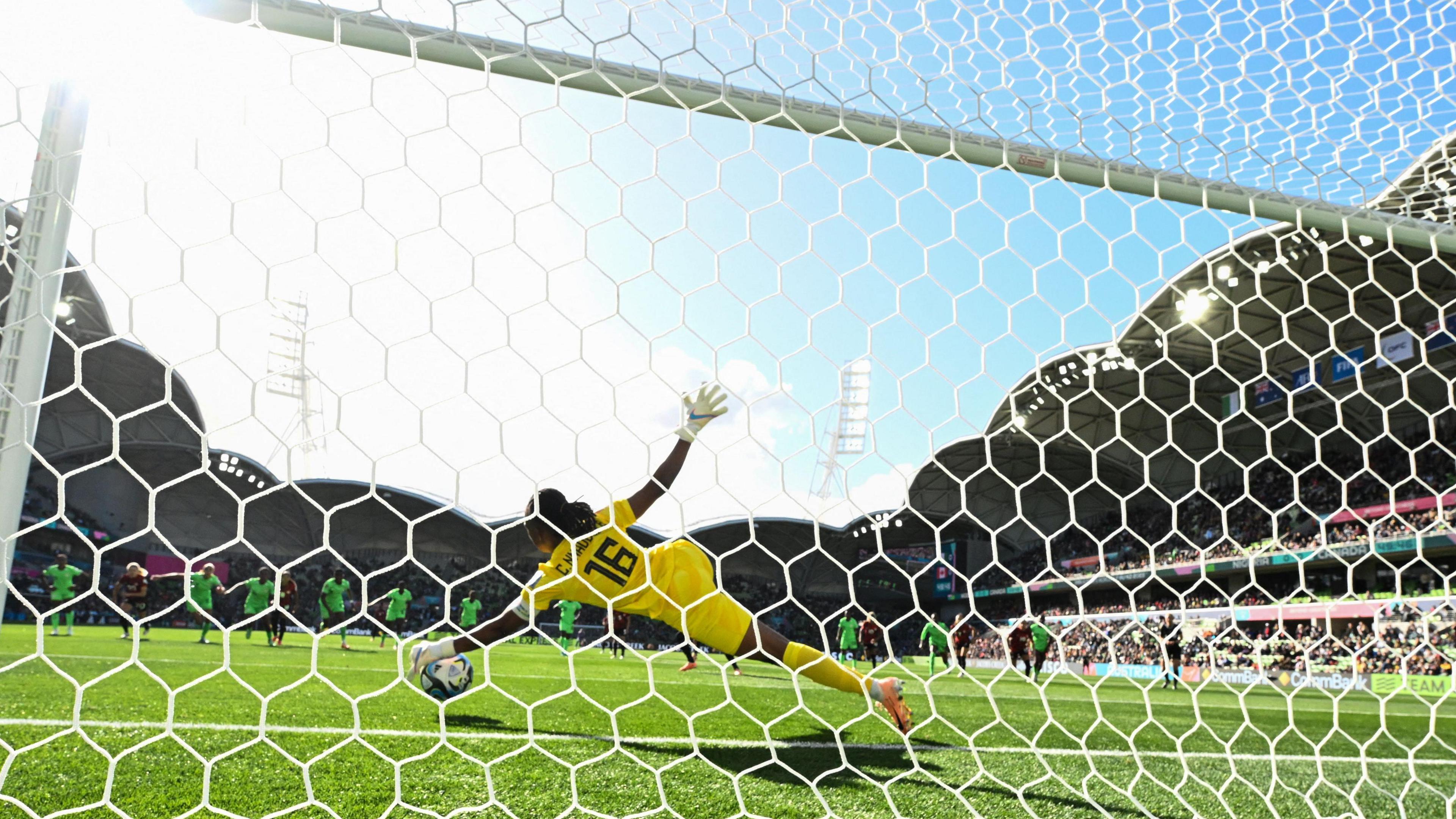 Nigeria's goalkeeper Chiamaka Nnadozie saves a penalty kick by Canada's Christine Sinclair at the 2023 Women's World Cup. 