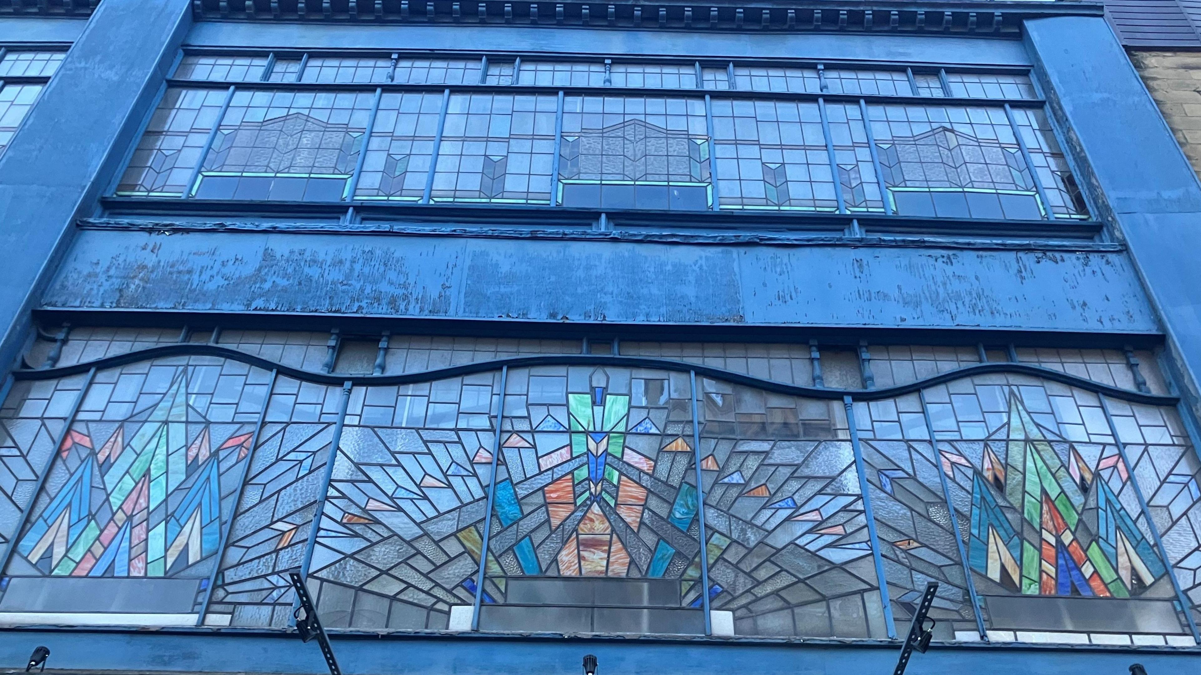 A close-up of the windows shows colourful elements in different shapes.