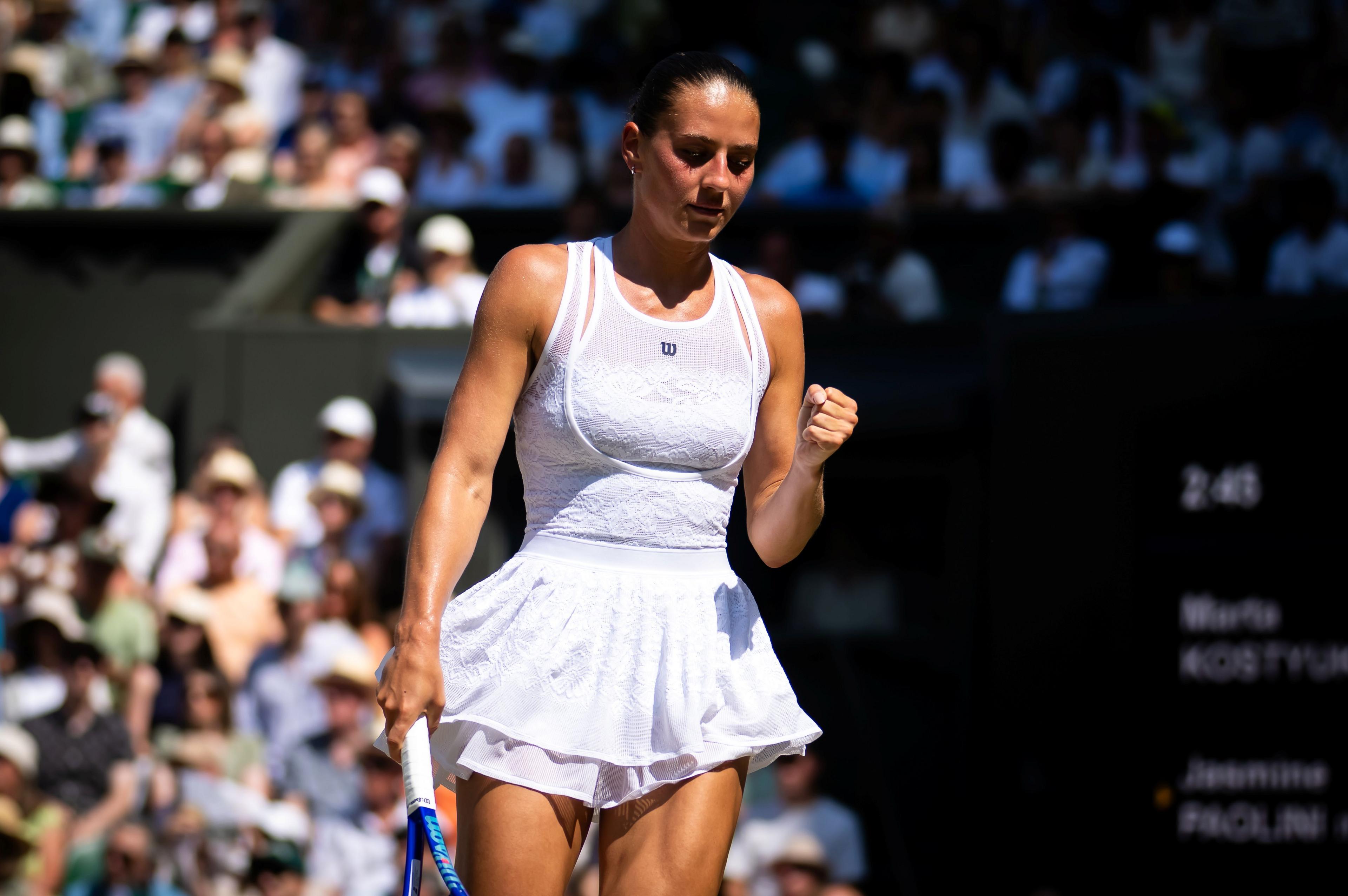 Marta Kostyuk celebrates a point