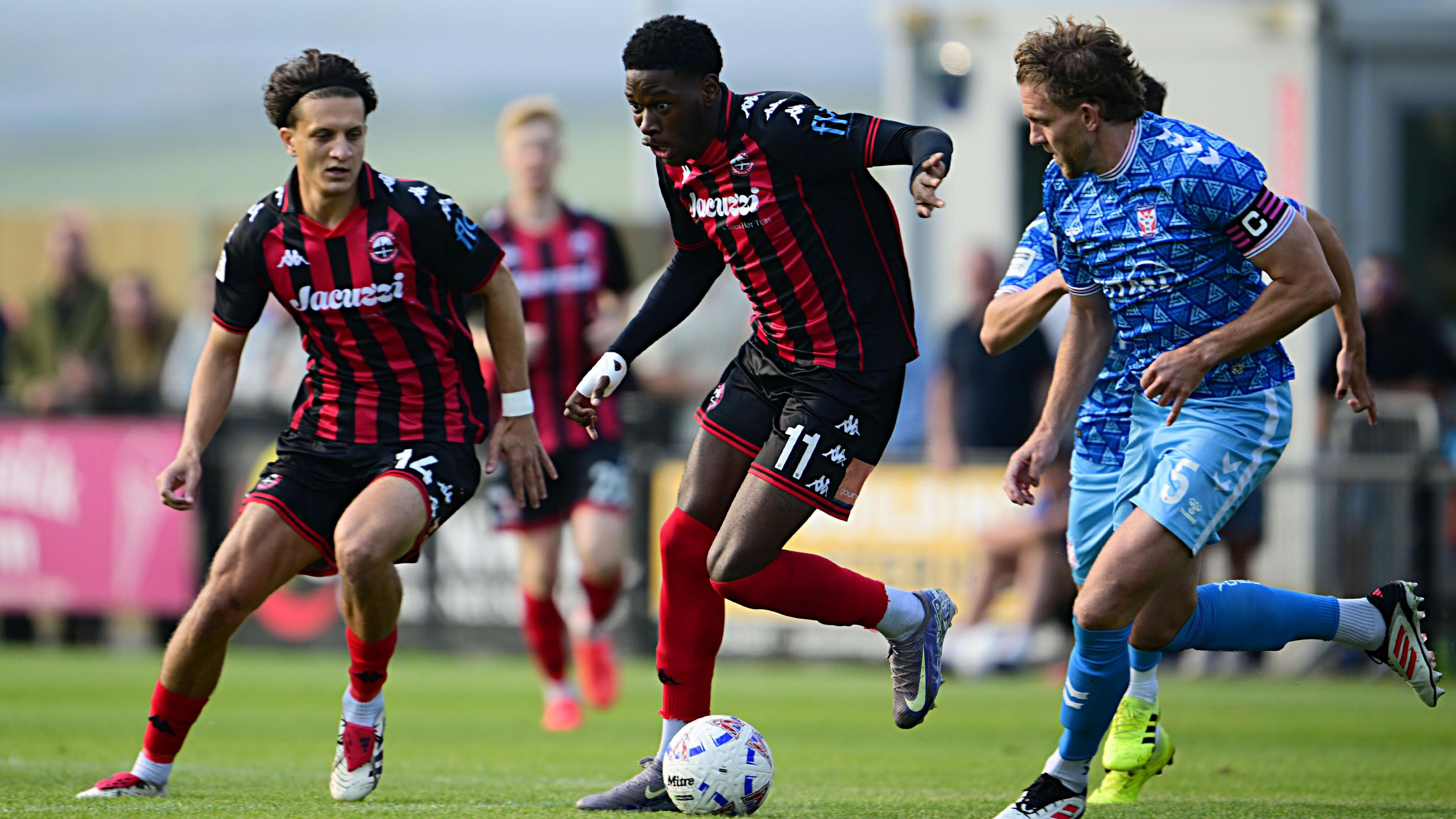 Dominic Johnson-Fisher wins the ball for Truro City