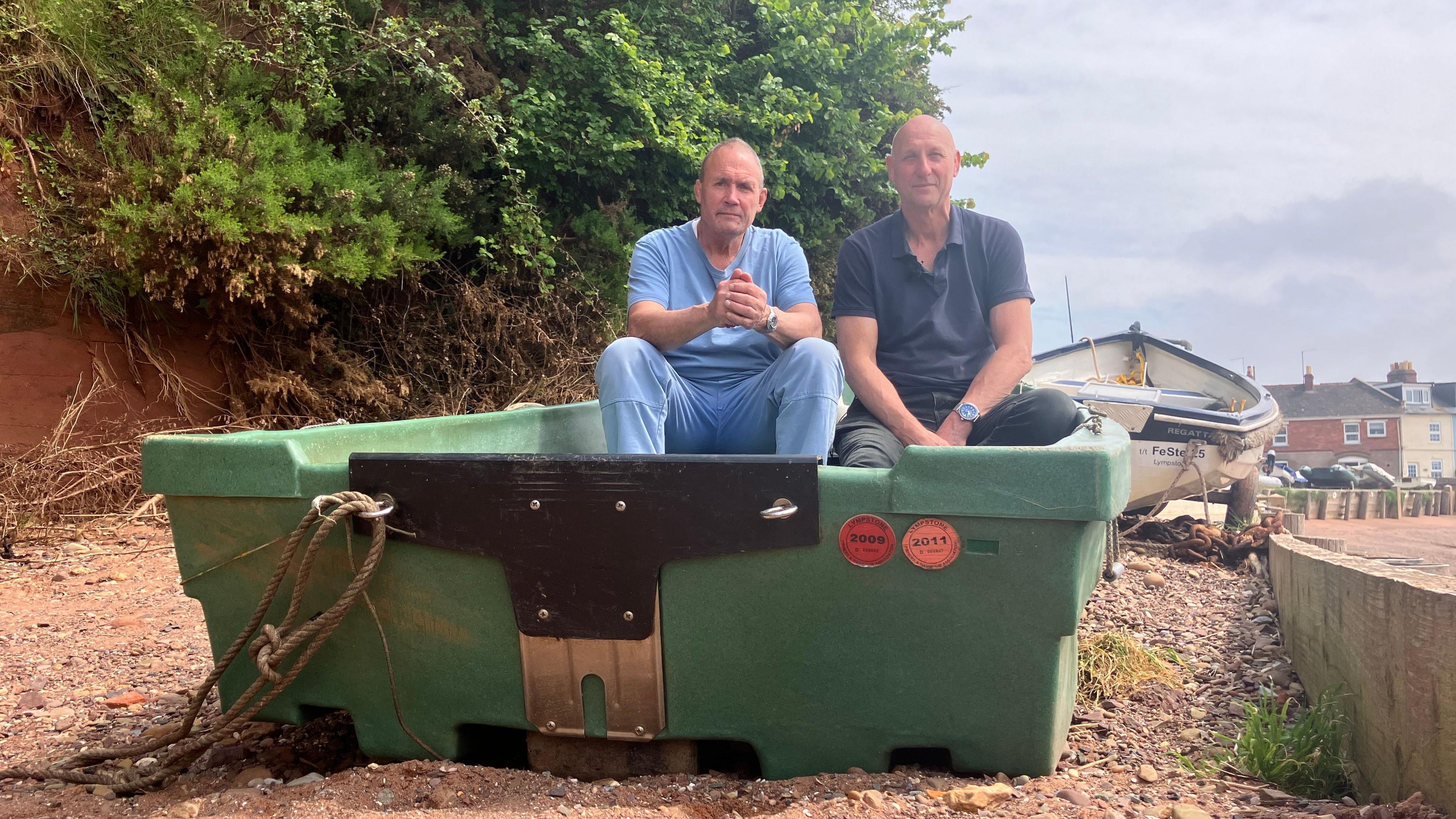 Two men in a small boat