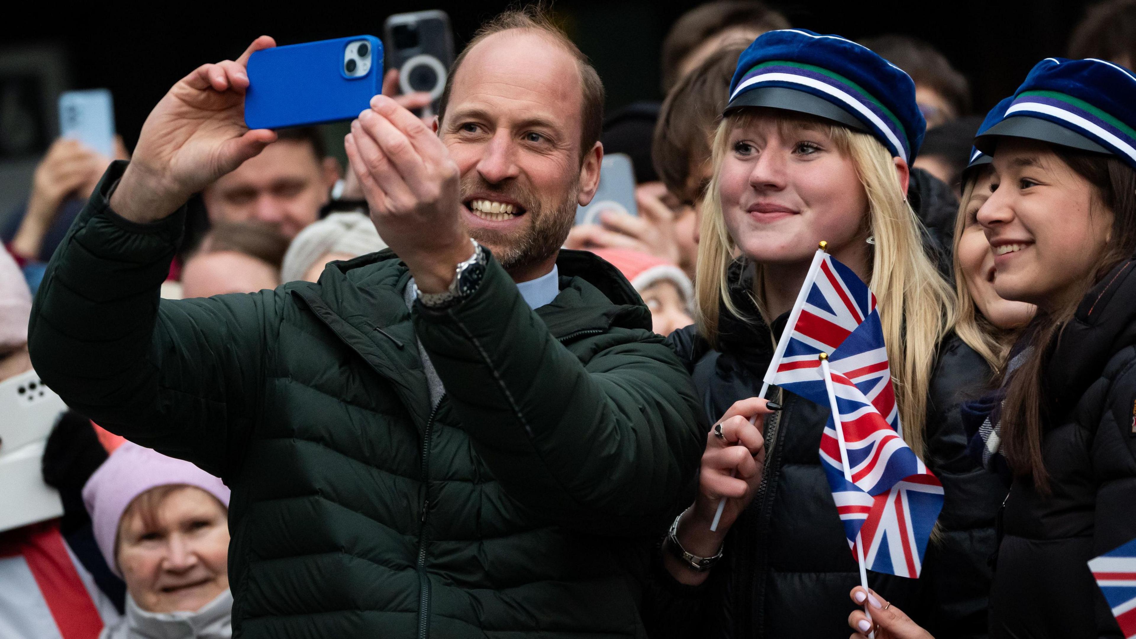 Prince William taking a selfie with crowds in Tallinn