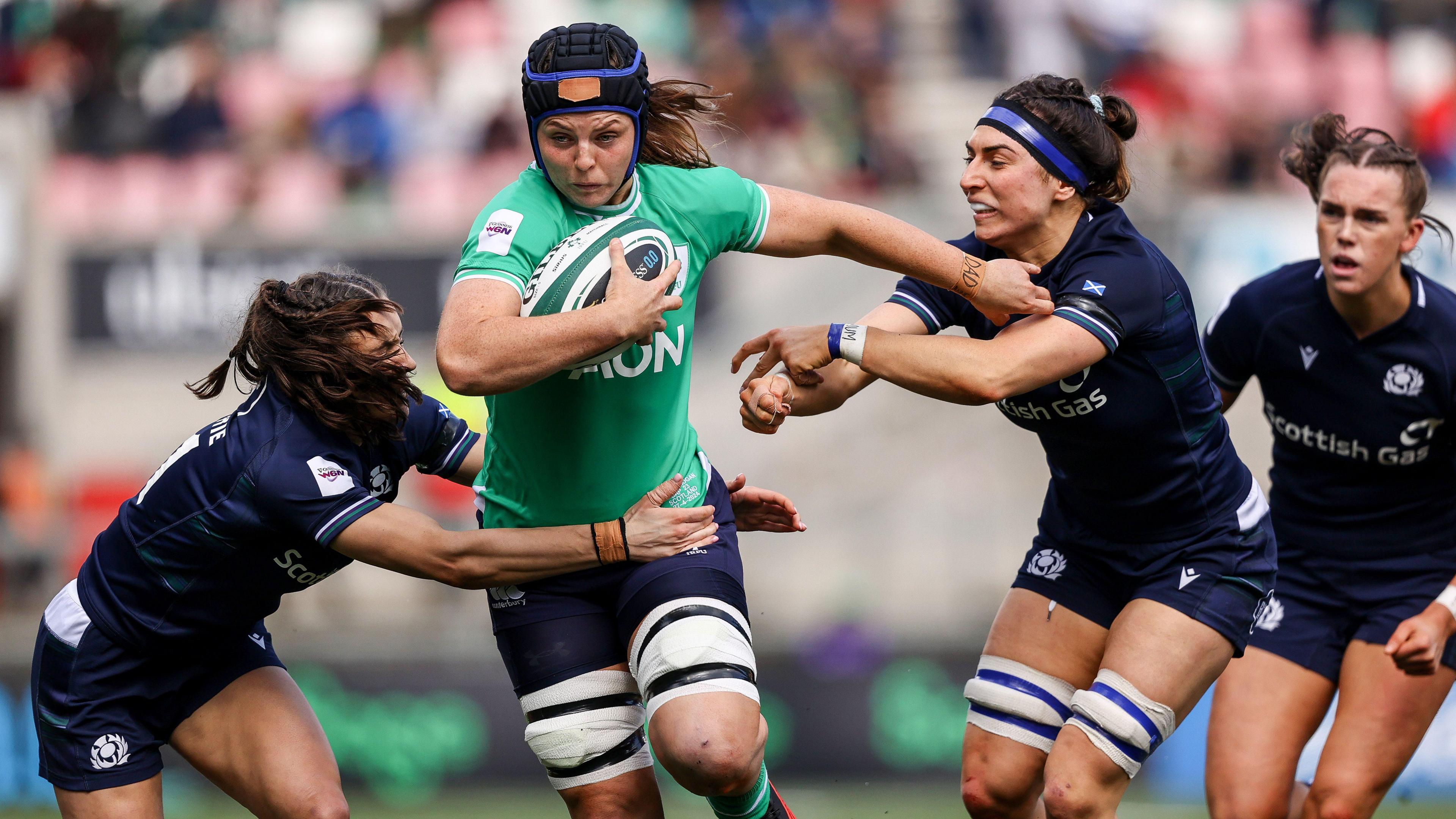 Brittany Hogan carries the ball against Scotland