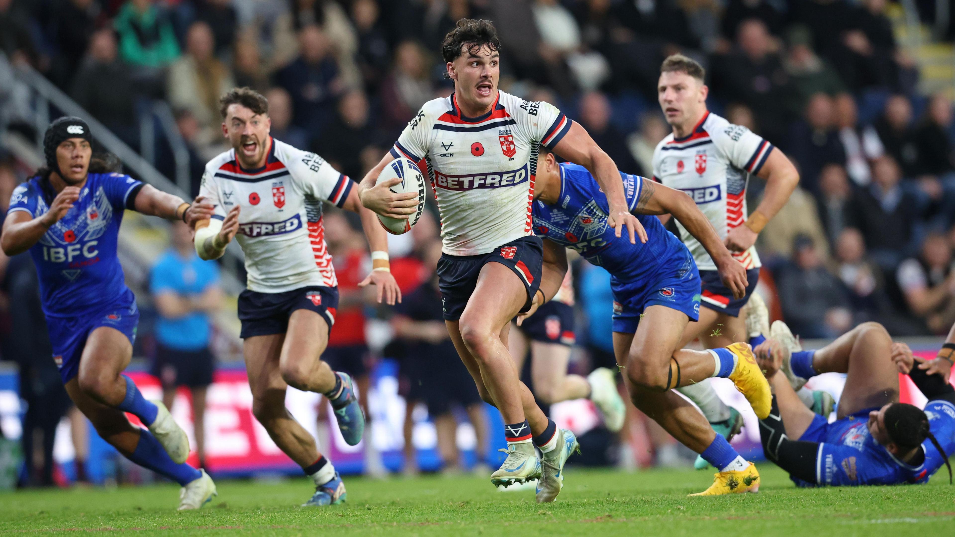Herbie Farnworth runs with the ball against Samoa