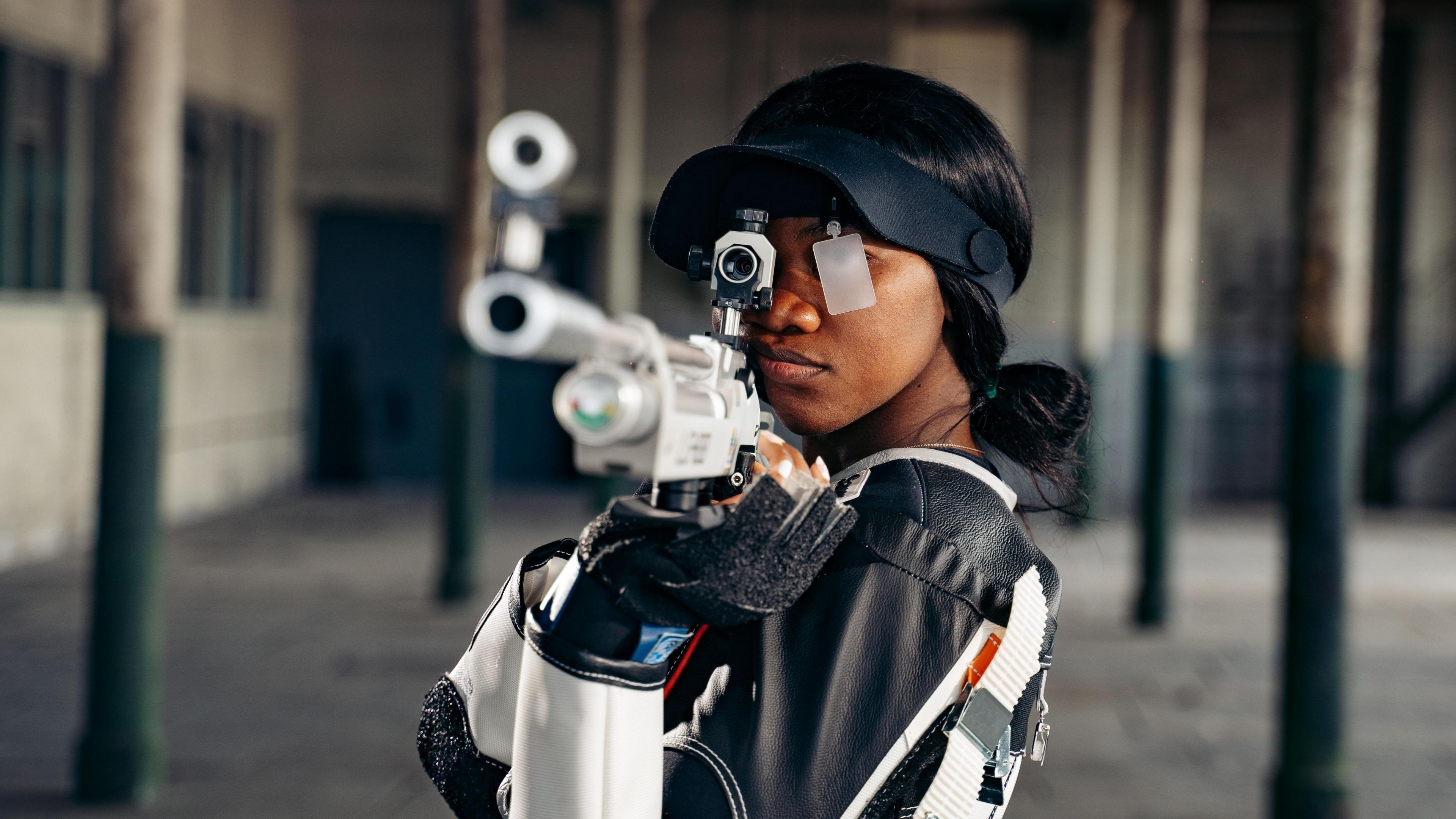 GB shooter Ruth Mwandumba with her rifle