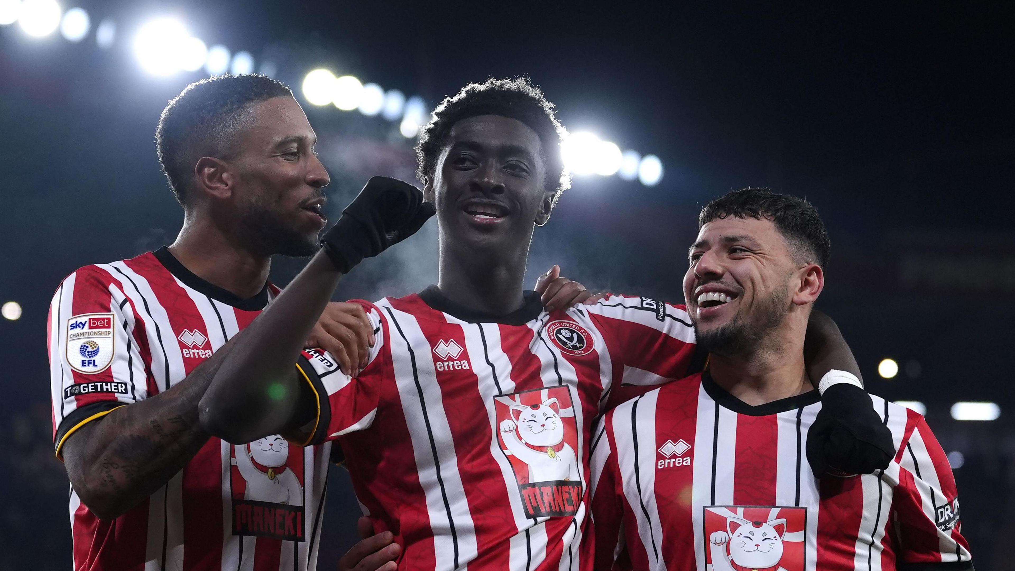 Jesuran Rak-Sakyi (centre) celebrates his fourth league goal of the season