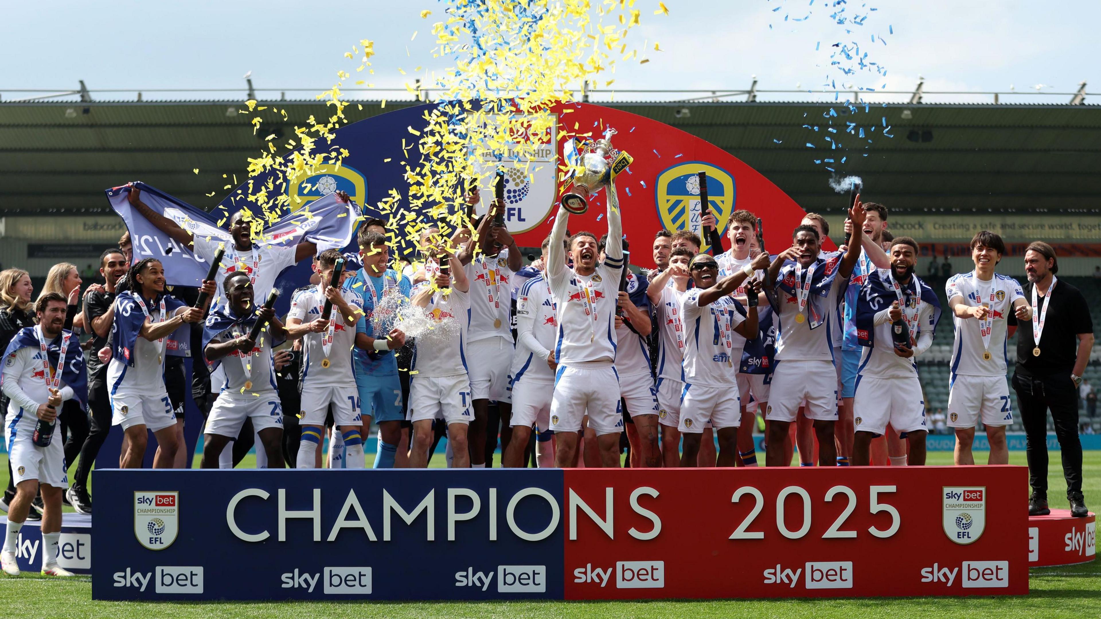 Leeds United players celebrate after clinching the Championship title