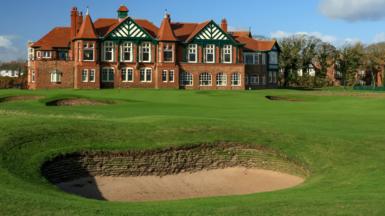 A view of a bunker in front of the 18th green at Royal Lytham & St Annes, with the clubhouse in the background