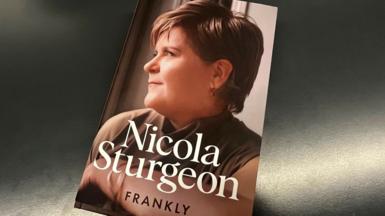 A copy of a book with Nicola Sturgeon in side profile. The words Nicola Sturgeon are in white letters, with Frankly written beneath her name