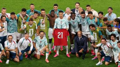 Cristiano Ronaldo holds Diogo Jota's '21' shirt aloft for Portugal